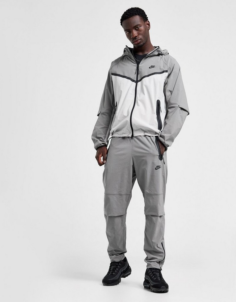 NIKE КОФТА З КАПЮШОНОМ M NK TCH WVN WR FZ JKT HM7151-014 Сірий