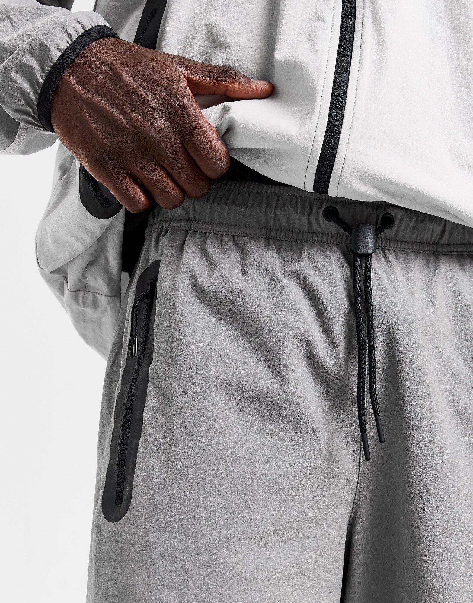 NIKE SPODNIE M NK TCH WVN OH PANT HM8241-014 Szary