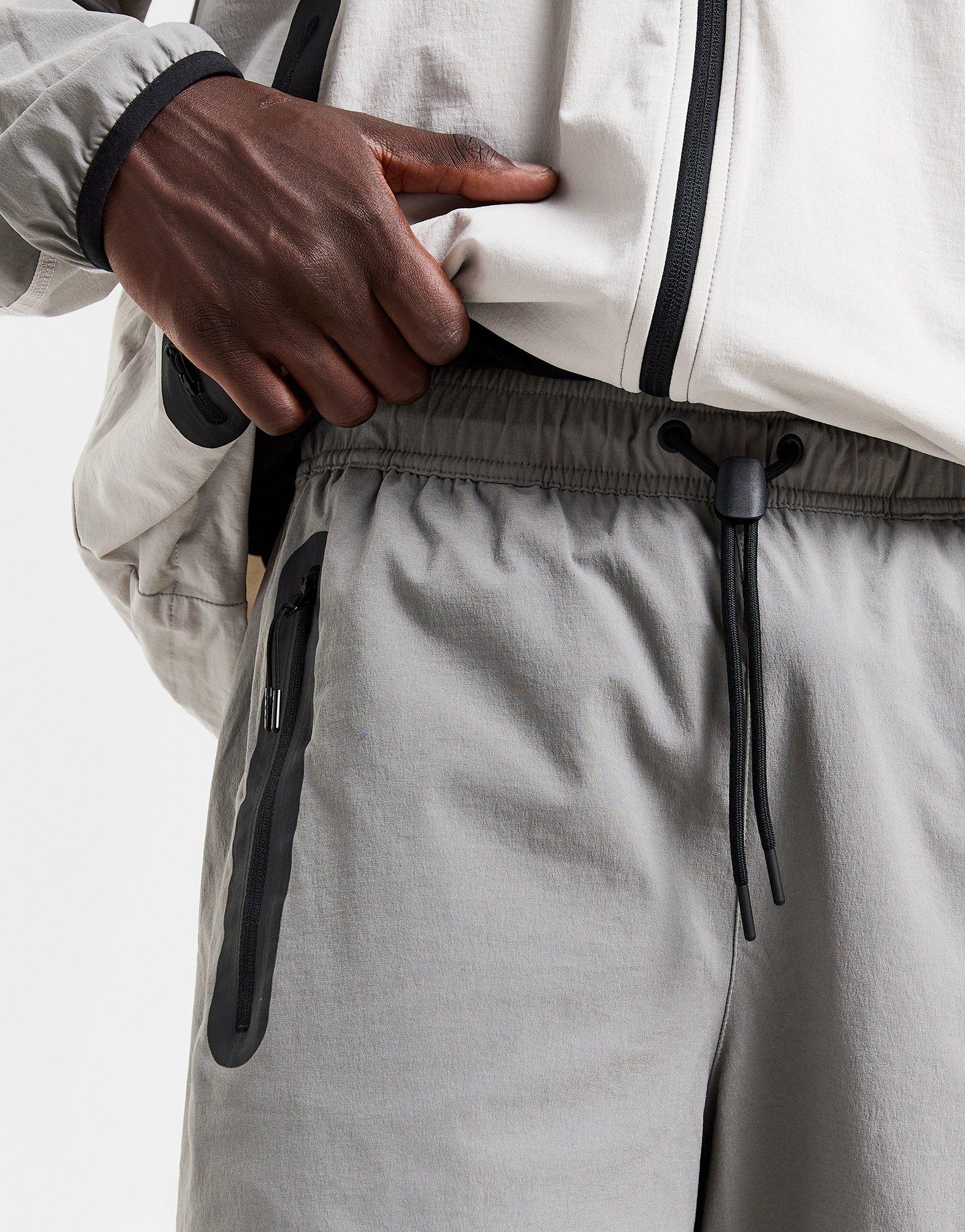 NIKE SPODNIE M NK TCH WVN OH PANT HM8241-014 Szary