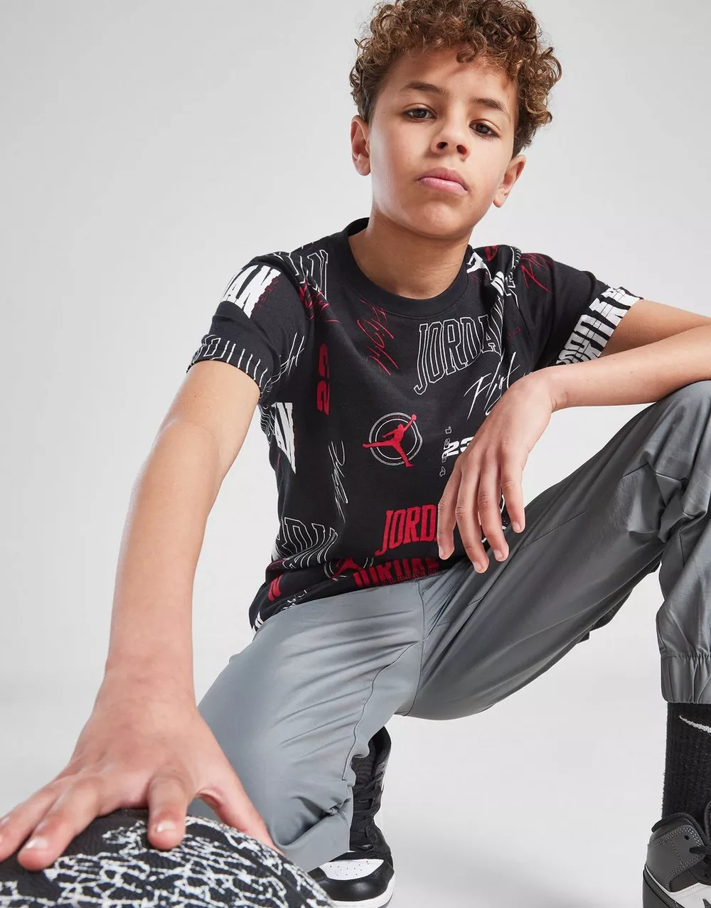 NikeHad JORDAN ФУТБОЛКА ARC AOP TEE BLK/RED B, фото 1 з 5