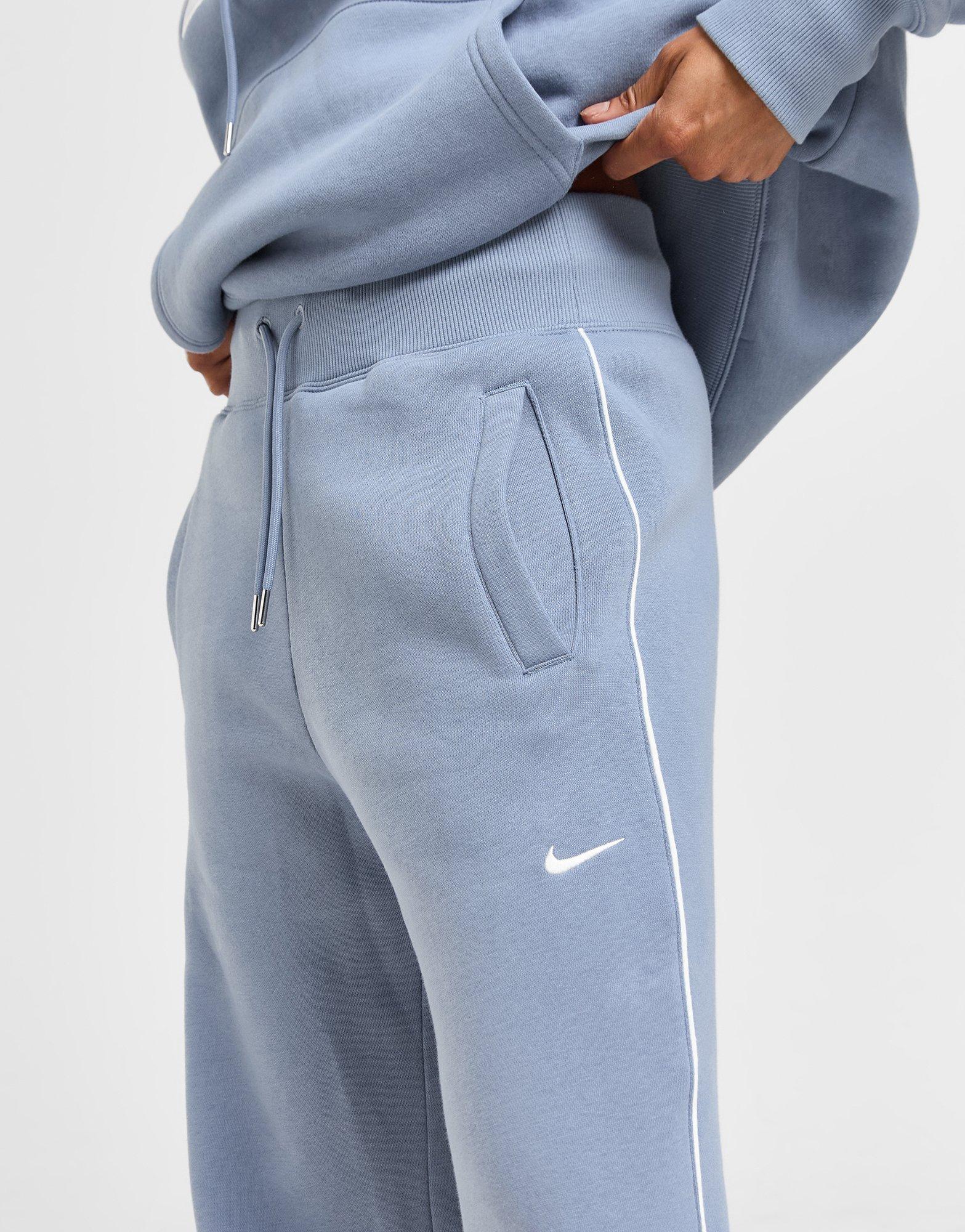Dámské kalhoty NIKE KALHOTY  W NSW PHNX FLC PANT TRND HV3775-493 Modrá