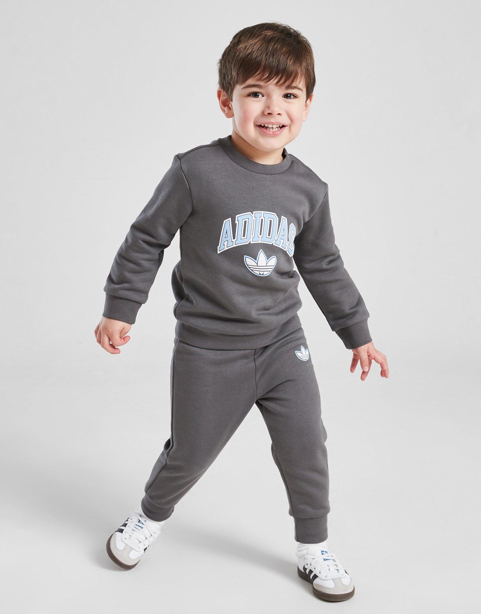 Детски анцуг ADIDAS КОМПЛЕКТ VARSITY OH SUIT GRY/BLU$ B JM1294 Сив