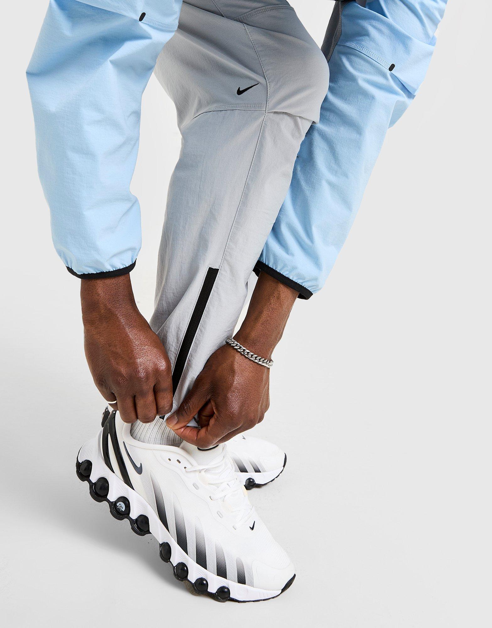 Pánské kalhoty NIKE KALHOTY  M NK TCH WVN OH PANT IB6663-012 Šedá