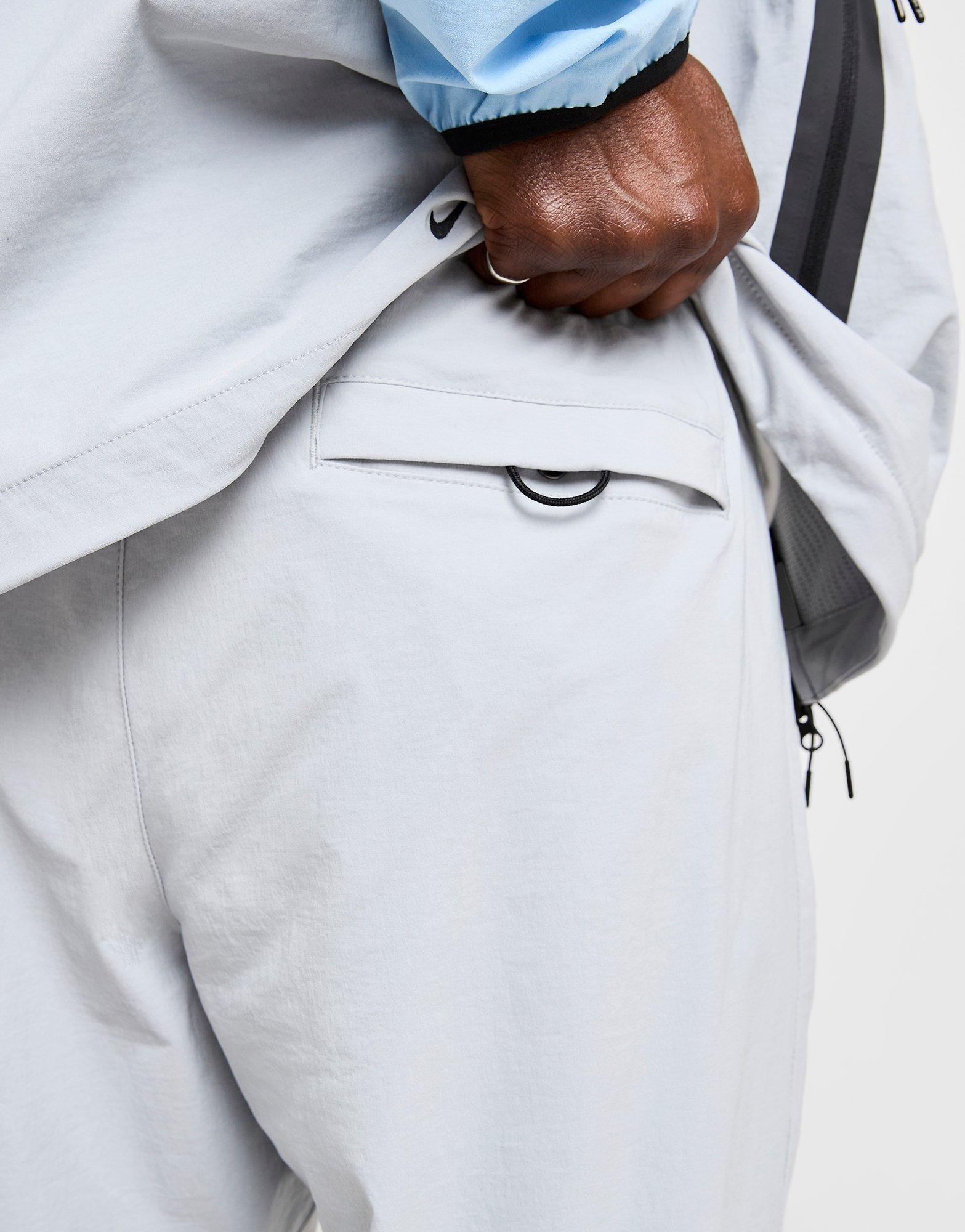 Pánské kalhoty NIKE KALHOTY  M NK TCH WVN OH PANT IB6663-012 Šedá