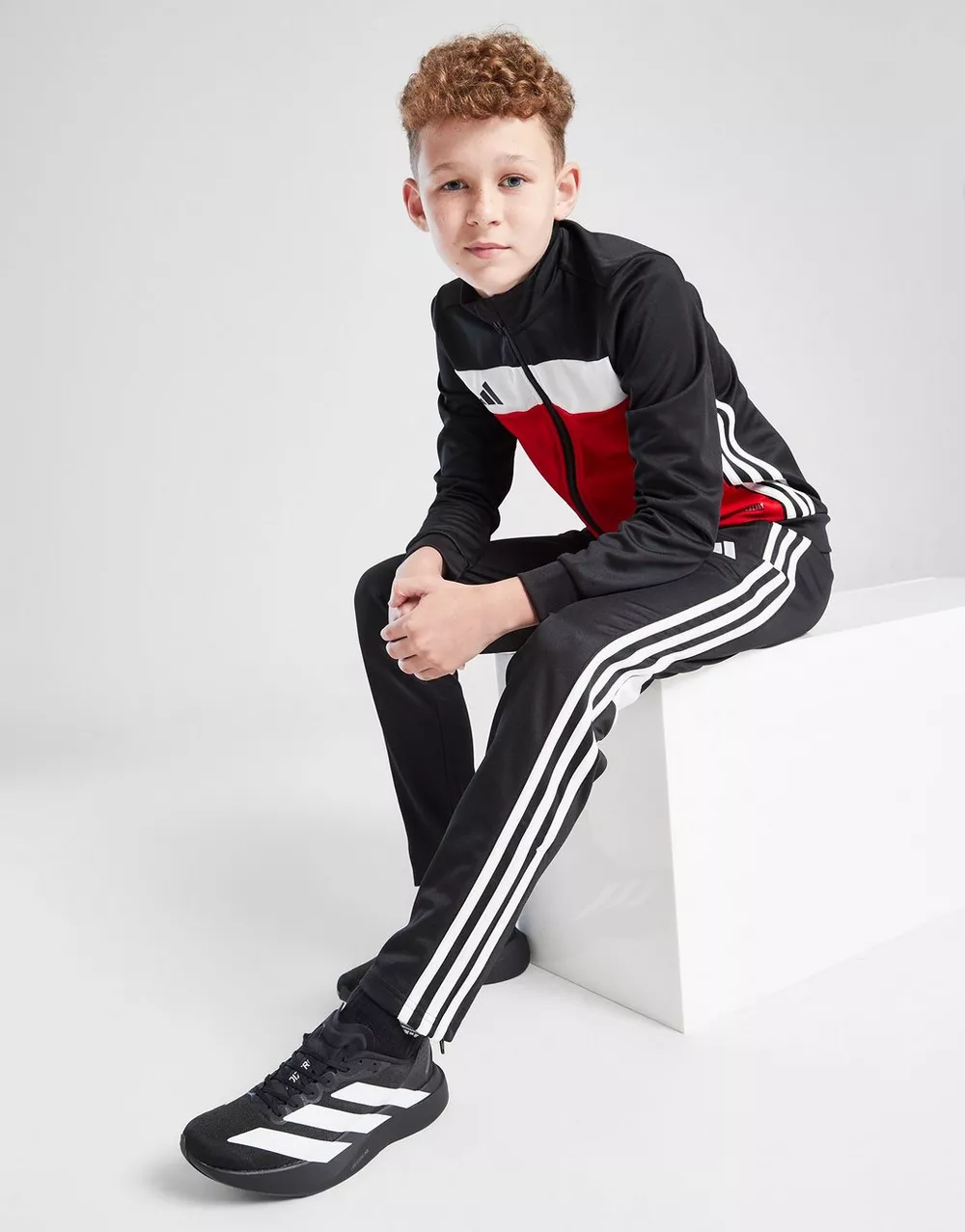 ADIDAS СПОРТИВНИЙ КОСТЮМ TIRO25   ESSENTIALS TRACKSUIT KIDS, фото 1 з 5