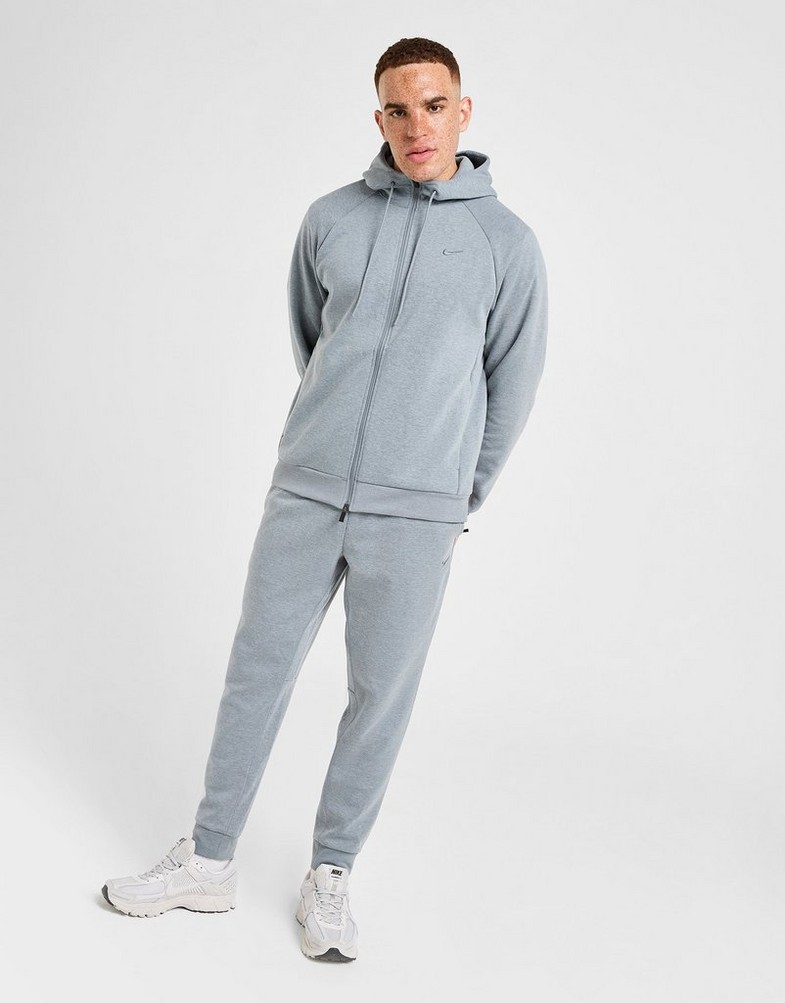 Pánske nohavice NIKE NOHAVICE  M NK DF UV PRIMARY JOGGER PANT FZ0975-065 Sivá