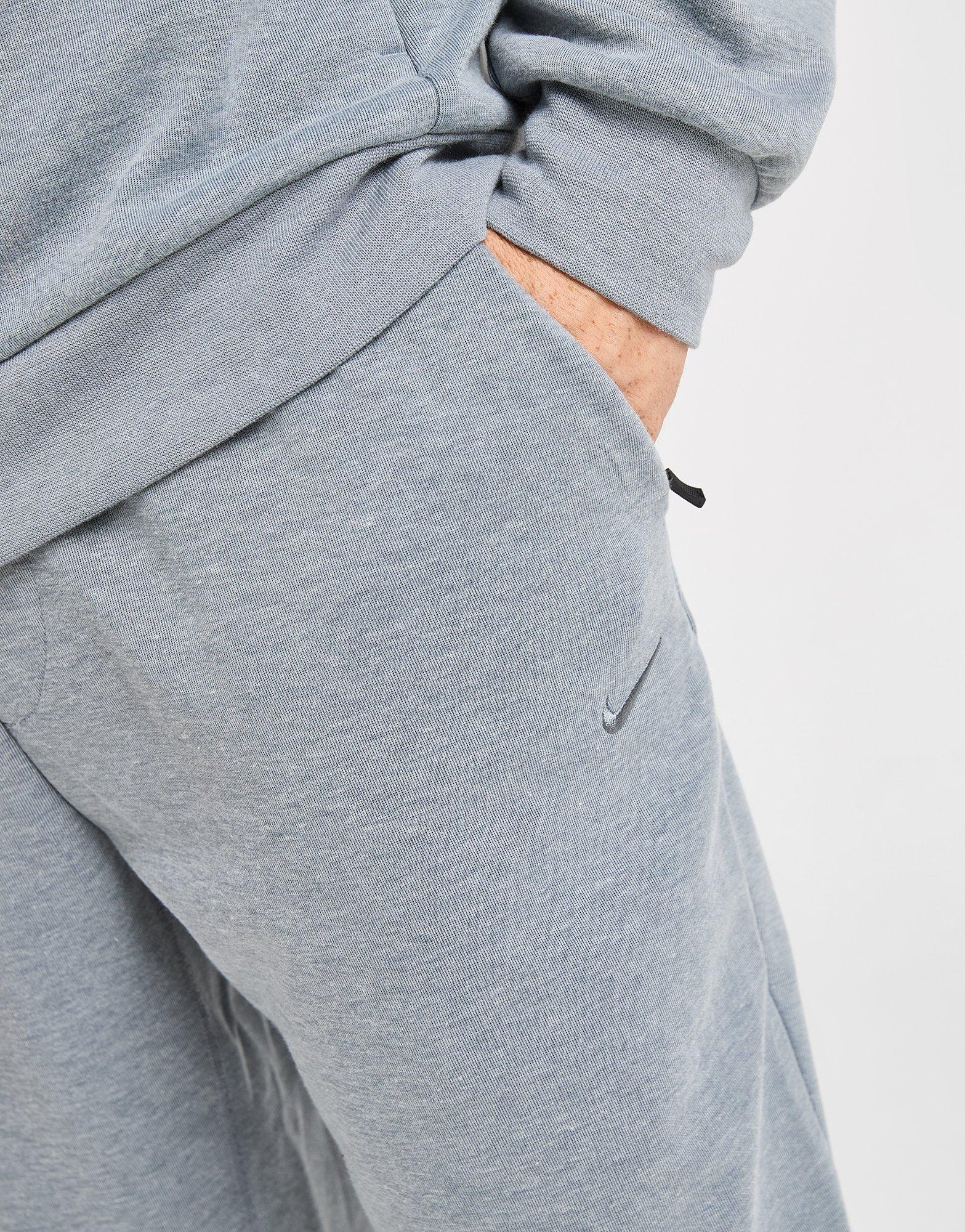 NIKE NADRÁG M NK DF UV PRIMARY JOGGER PANT FZ0975-065 Szürke