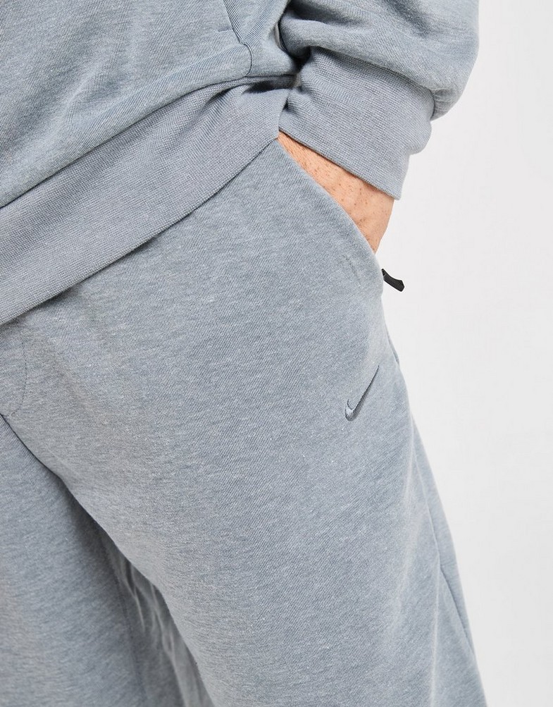 Pánske nohavice NIKE NOHAVICE  M NK DF UV PRIMARY JOGGER PANT FZ0975-065 Sivá