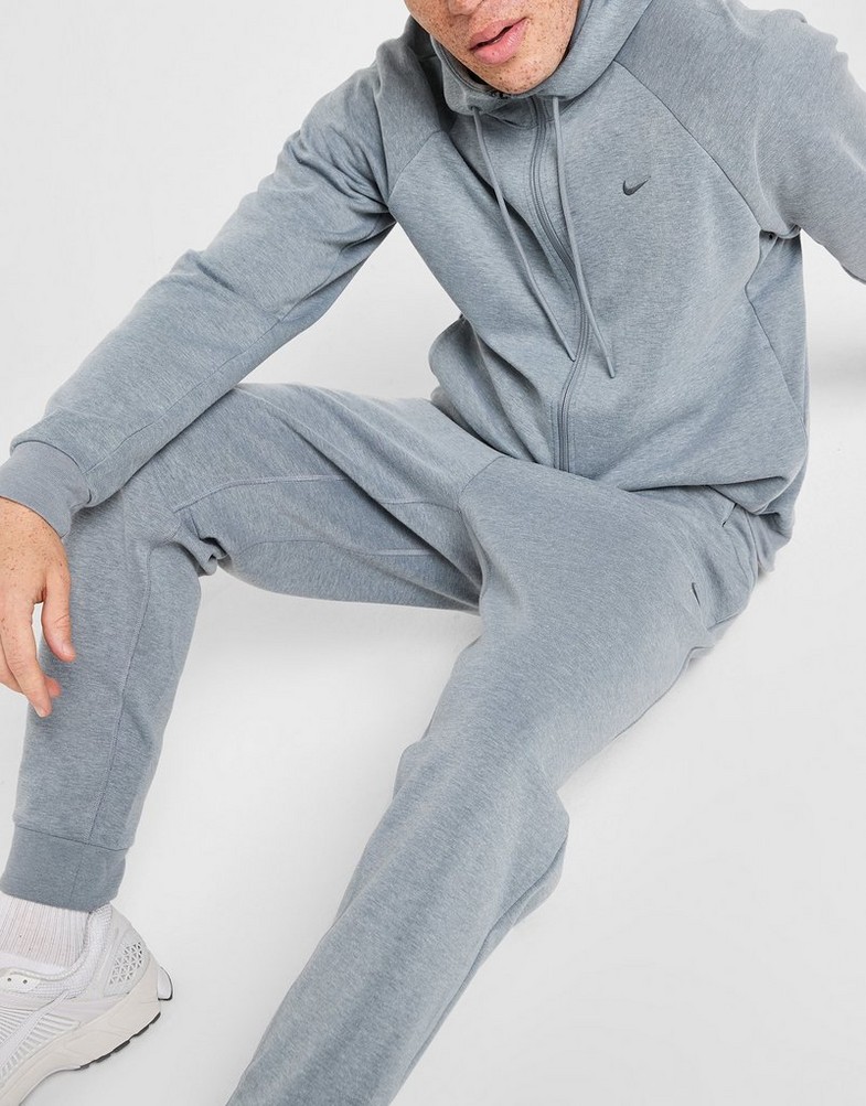 Pánske nohavice NIKE NOHAVICE  M NK DF UV PRIMARY JOGGER PANT FZ0975-065 Sivá