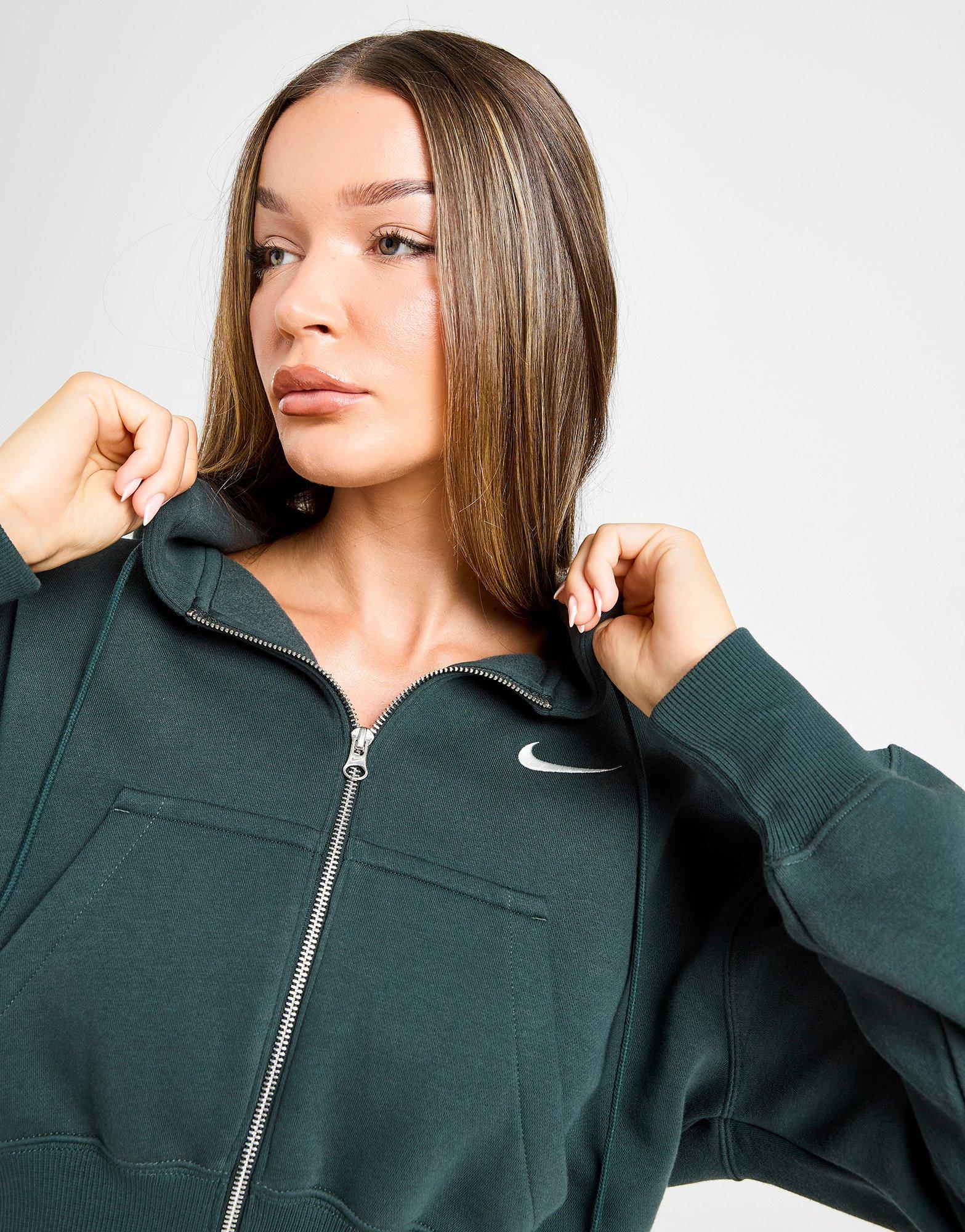 Bluză pentru femei NIKE BLUZĂ CU GLUGĂ W NSW PHNX FLC CRP HV2426-390 Verde