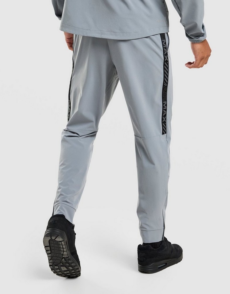 Pantaloni pentru bărbați NIKE PANTALONI  M NSW AIR MAX TC ST WVN PANT IF0385-065 Gri