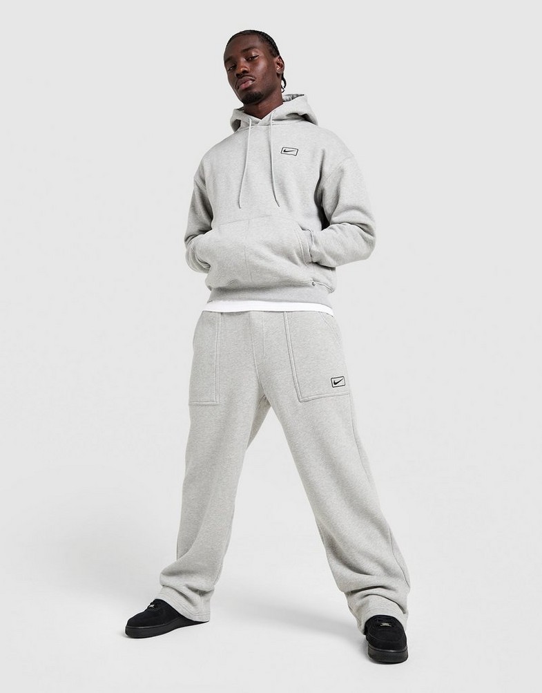 Pantaloni pentru bărbați NIKE PANTALONI  FLC WORKER JOGGER IQ2768-063 Gri