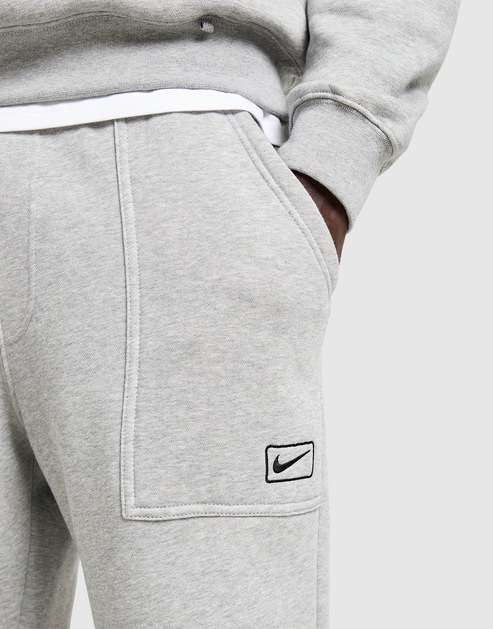 Чоловічі штани NIKE ШТАНИ FLC WORKER JOGGER IQ2768-063 Сірий