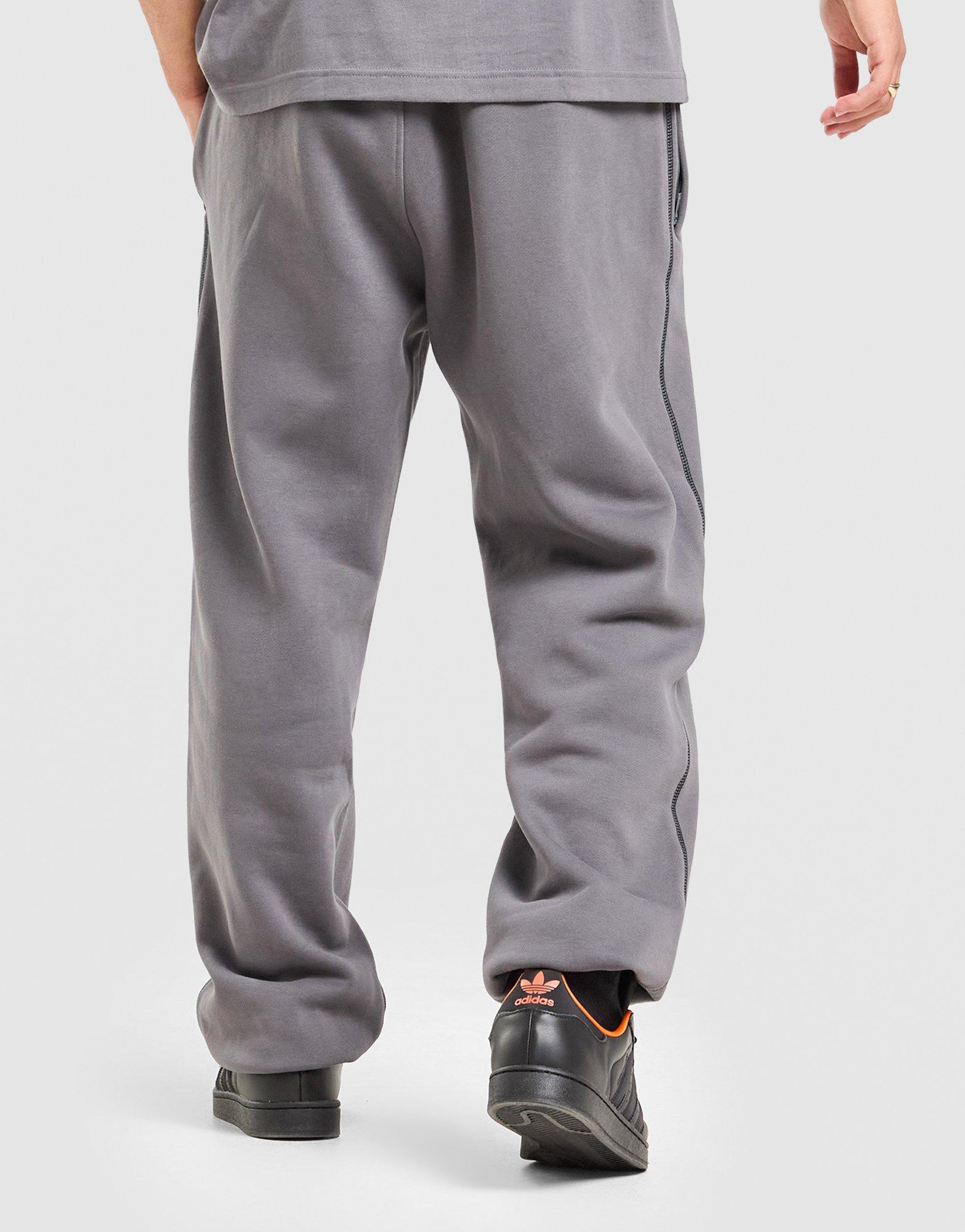 Чоловічі штани ADIDAS ШТАНИ GFX PT LO KG8597 Сірий