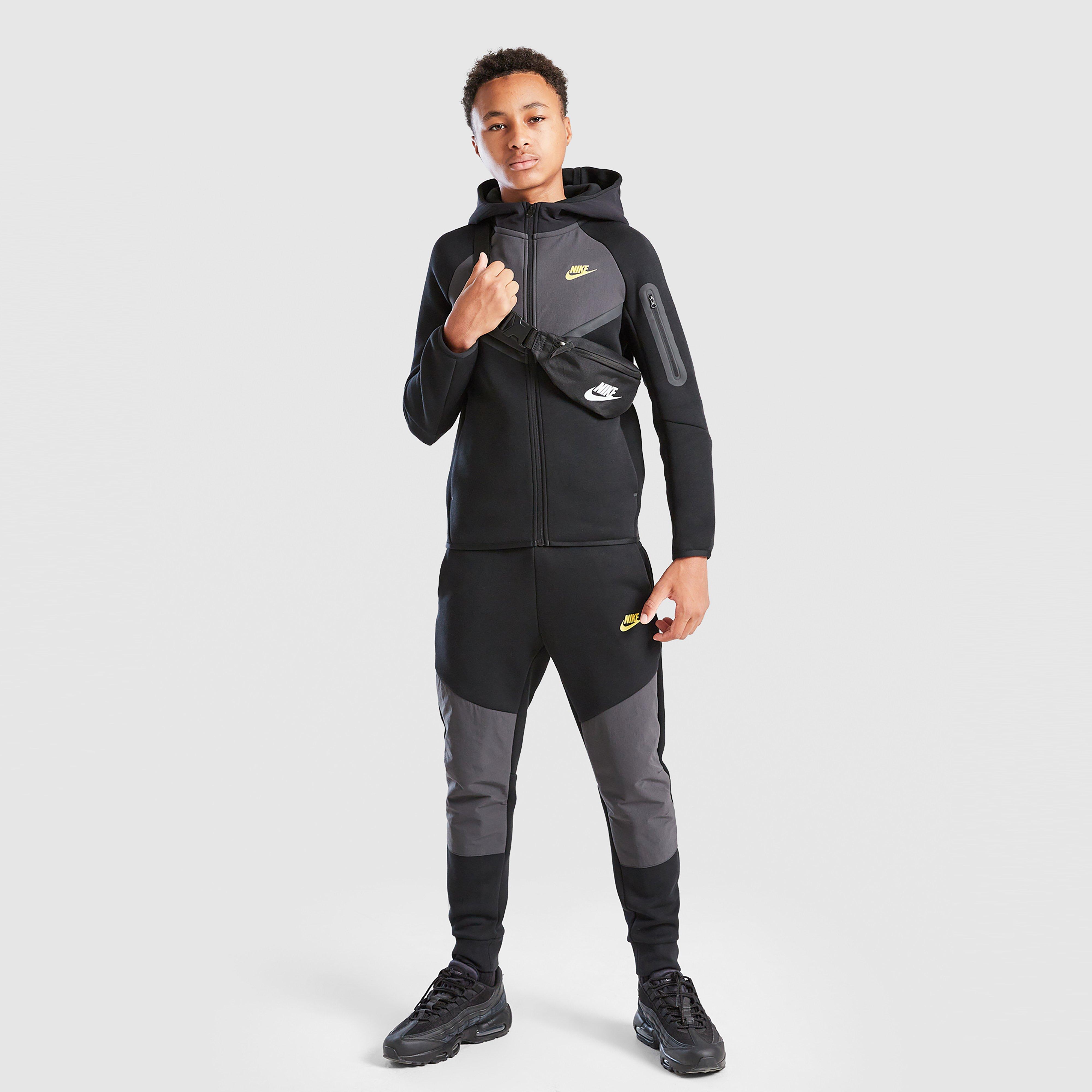 Detské nohavice NIKE NOHAVICE  B NSW TCH FLC JGGR - PD