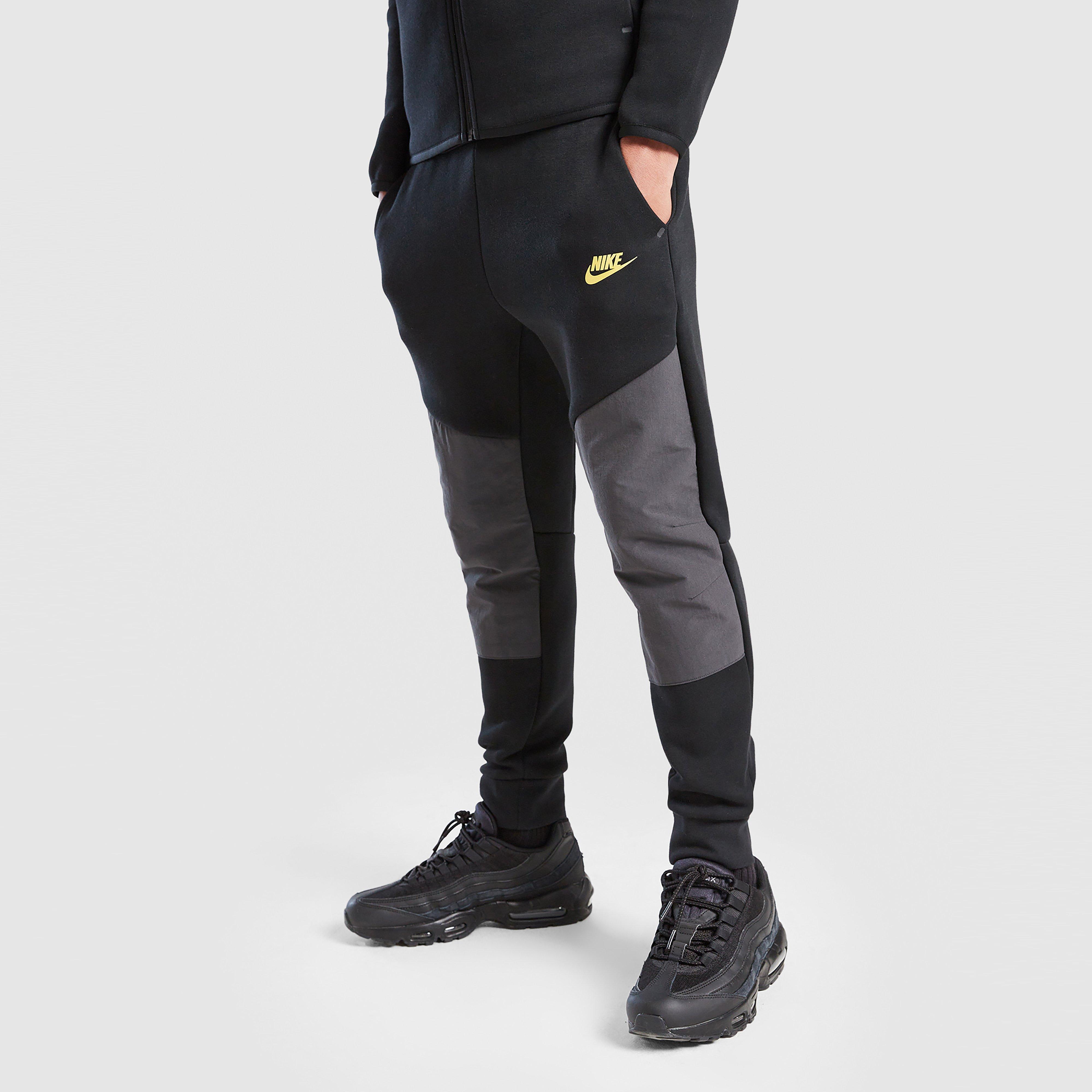 Detské nohavice NIKE NOHAVICE  B NSW TCH FLC JGGR - PD