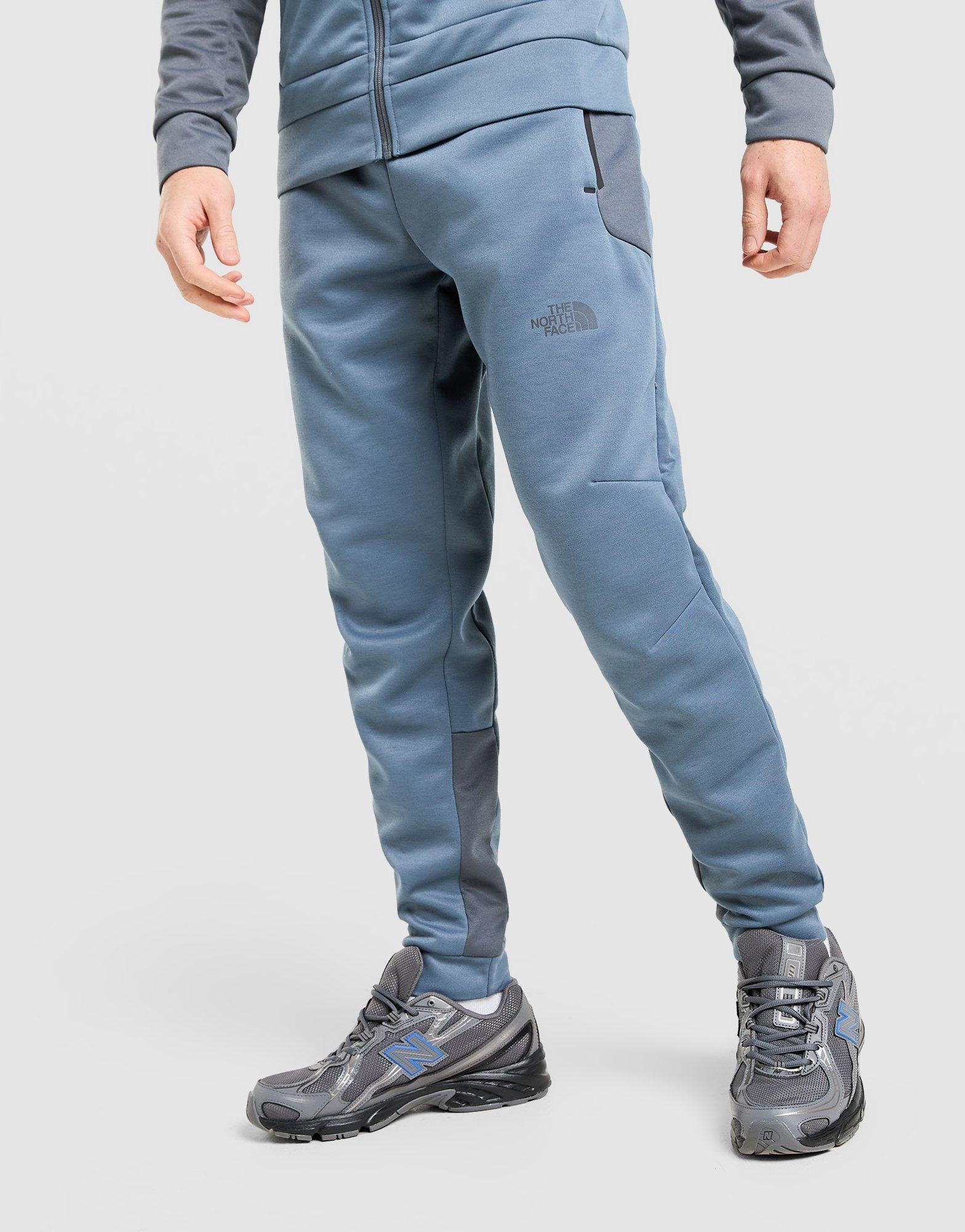 Pánske nohavice THE NORTH FACE NOHAVICE  M KAVEH JOGGER NF0A8HCFPGE1 Modrá