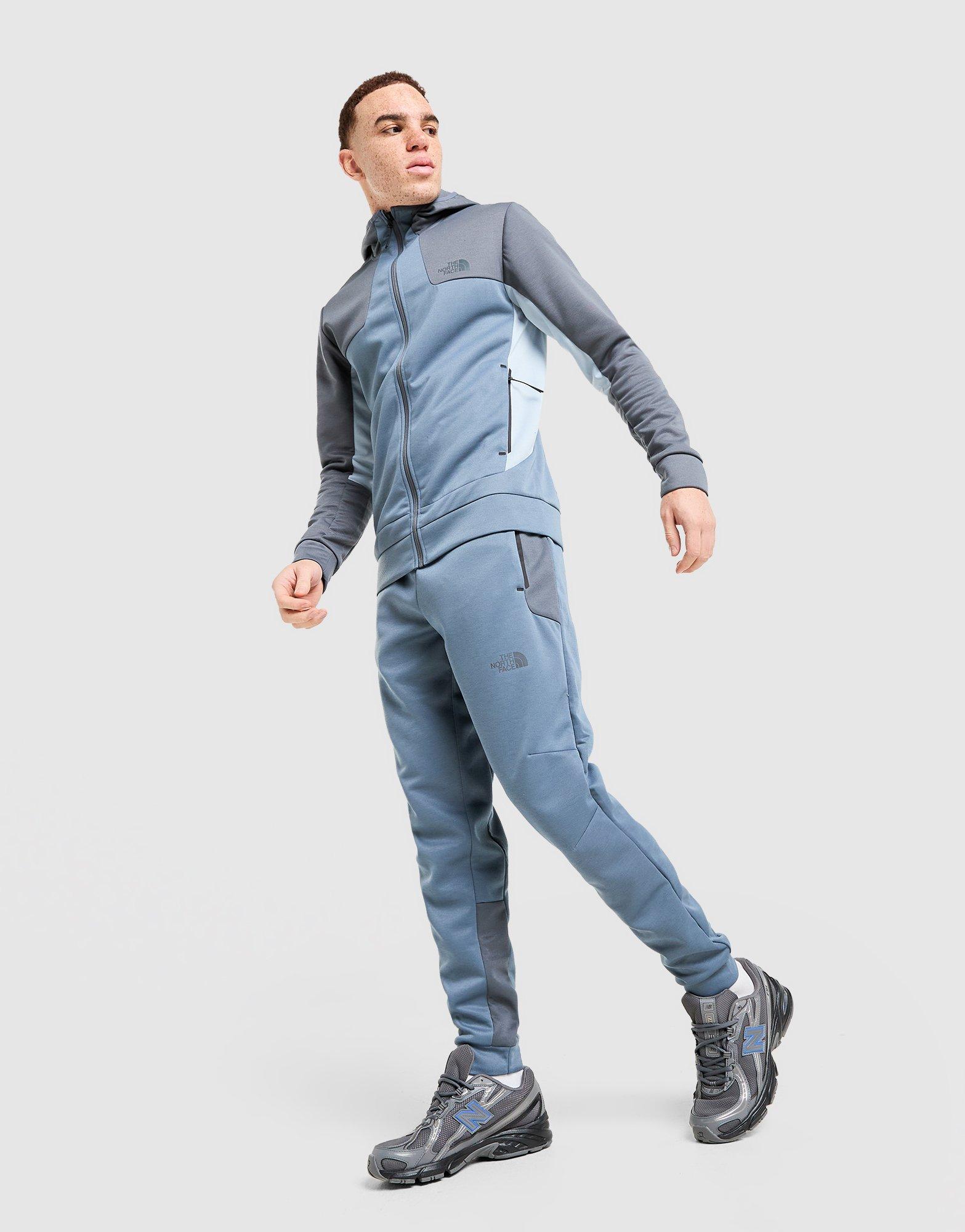 Pánske nohavice THE NORTH FACE NOHAVICE  M KAVEH JOGGER NF0A8HCFPGE1 Modrá