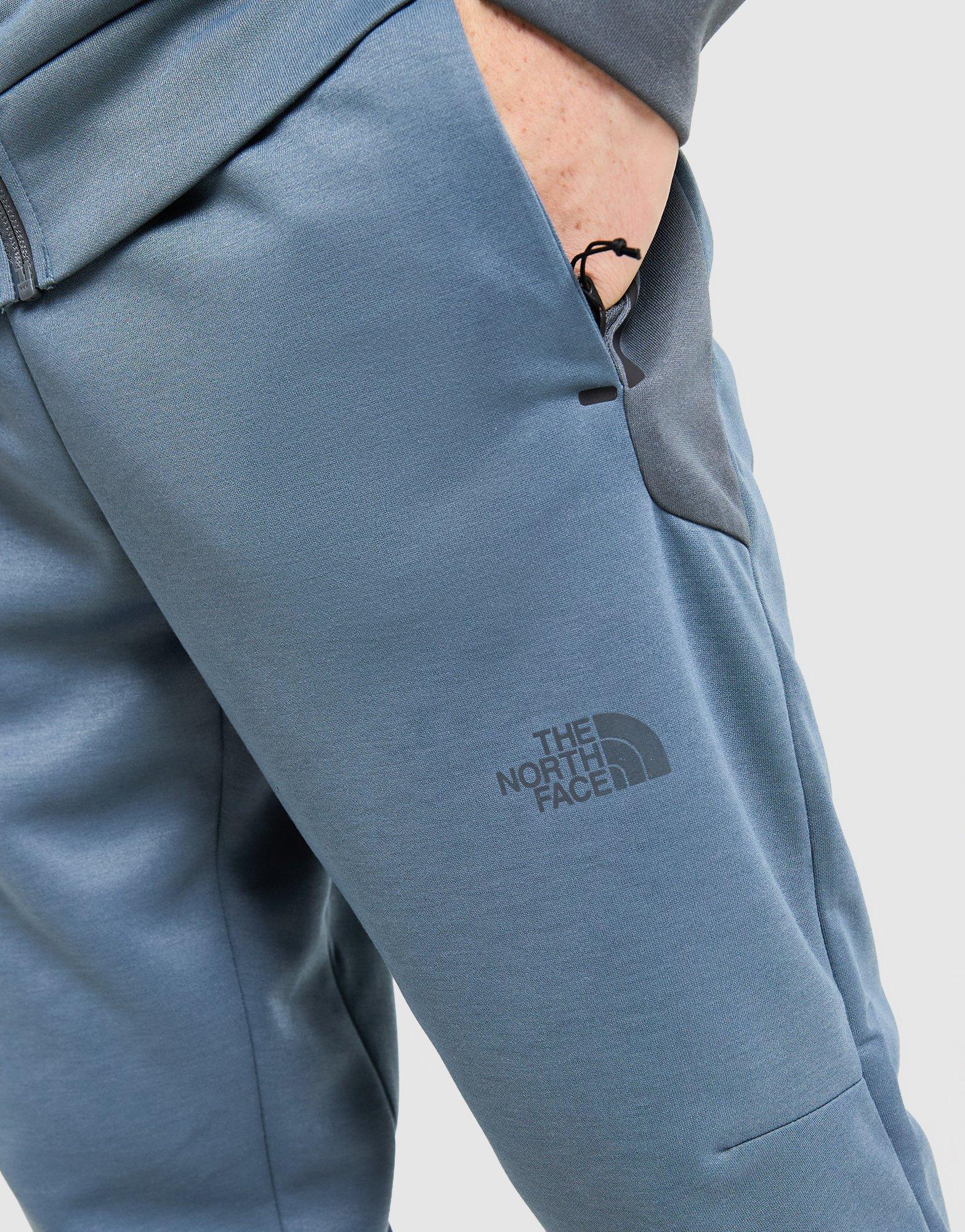 Pánske nohavice THE NORTH FACE NOHAVICE  M KAVEH JOGGER NF0A8HCFPGE1 Modrá