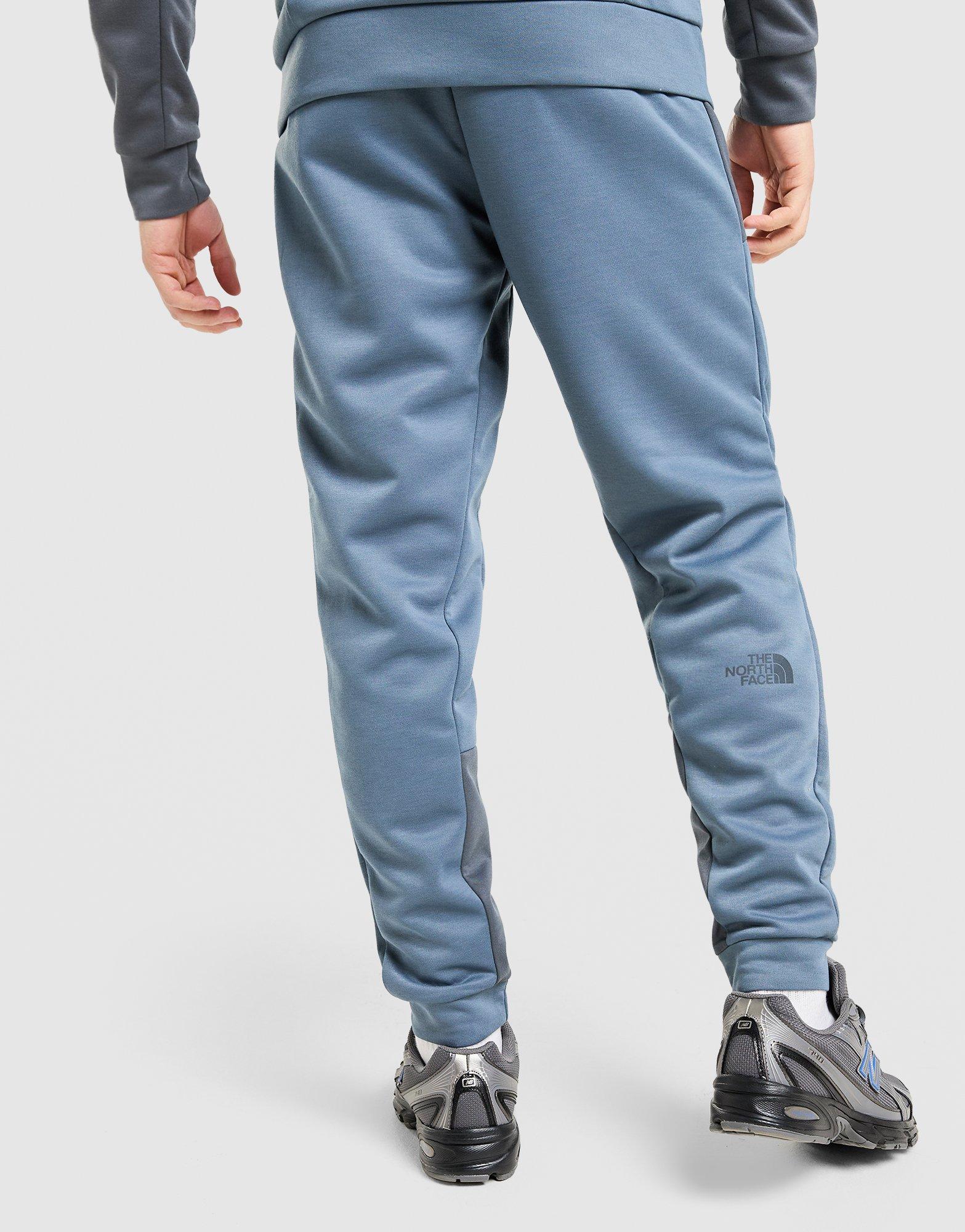 Pánske nohavice THE NORTH FACE NOHAVICE  M KAVEH JOGGER NF0A8HCFPGE1 Modrá