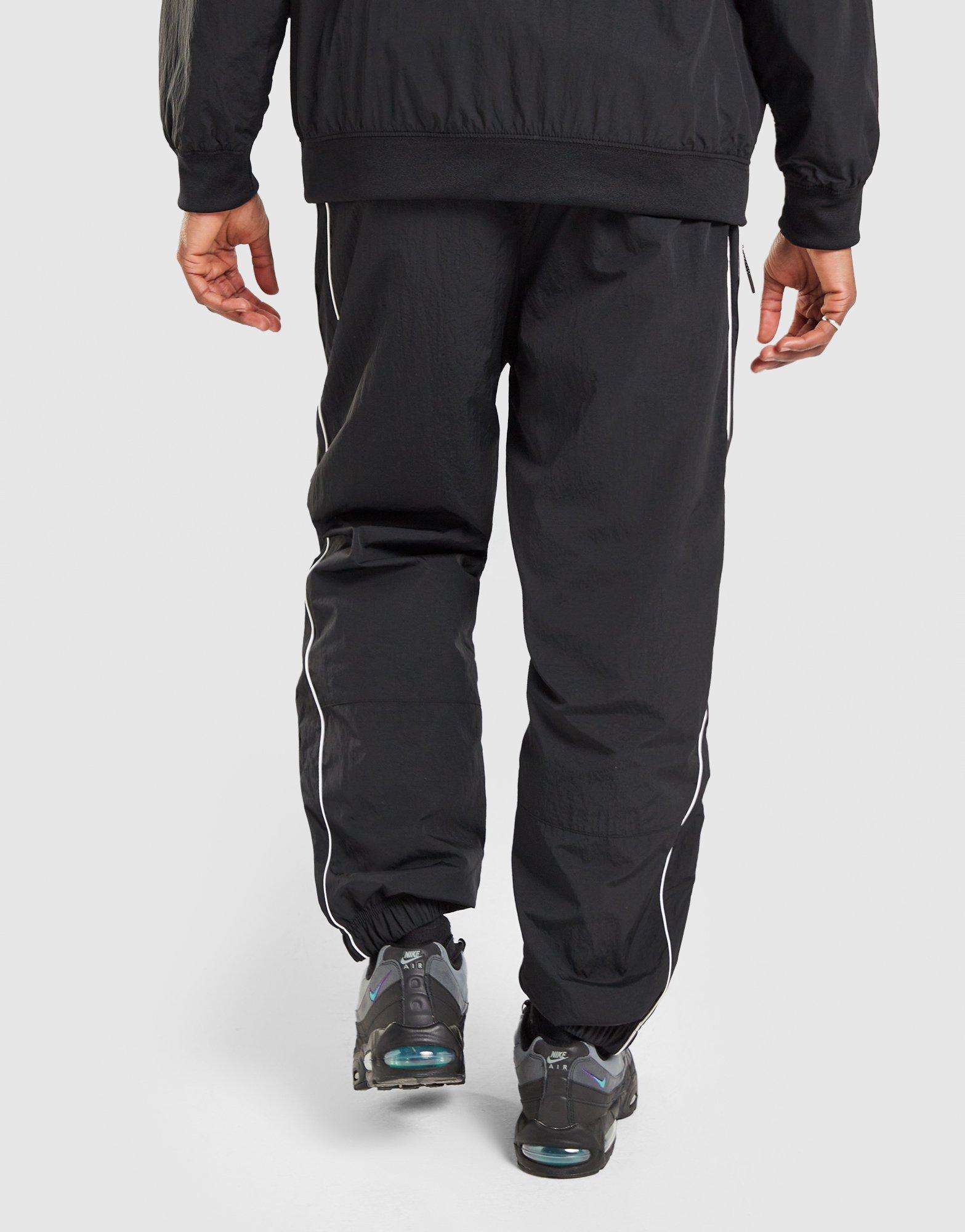 Pánske nohavice NIKE NOHAVICE  M NSW AIR MAX 95 WVN PANT IO3153-010 Čierna