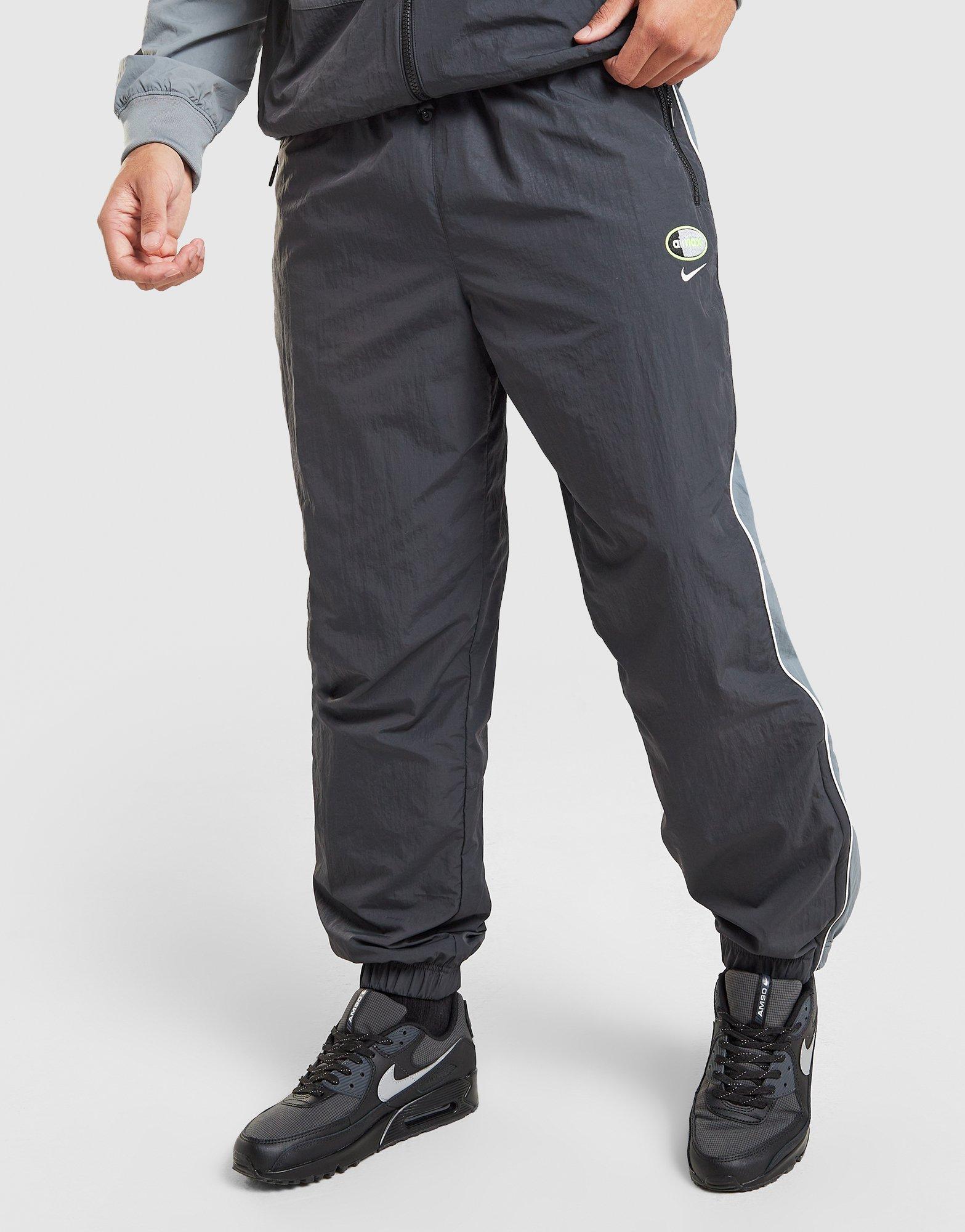 Pánské kalhoty NIKE KALHOTY  M NSW AIR MAX 95 WVN PANT IO3153-060 Šedá