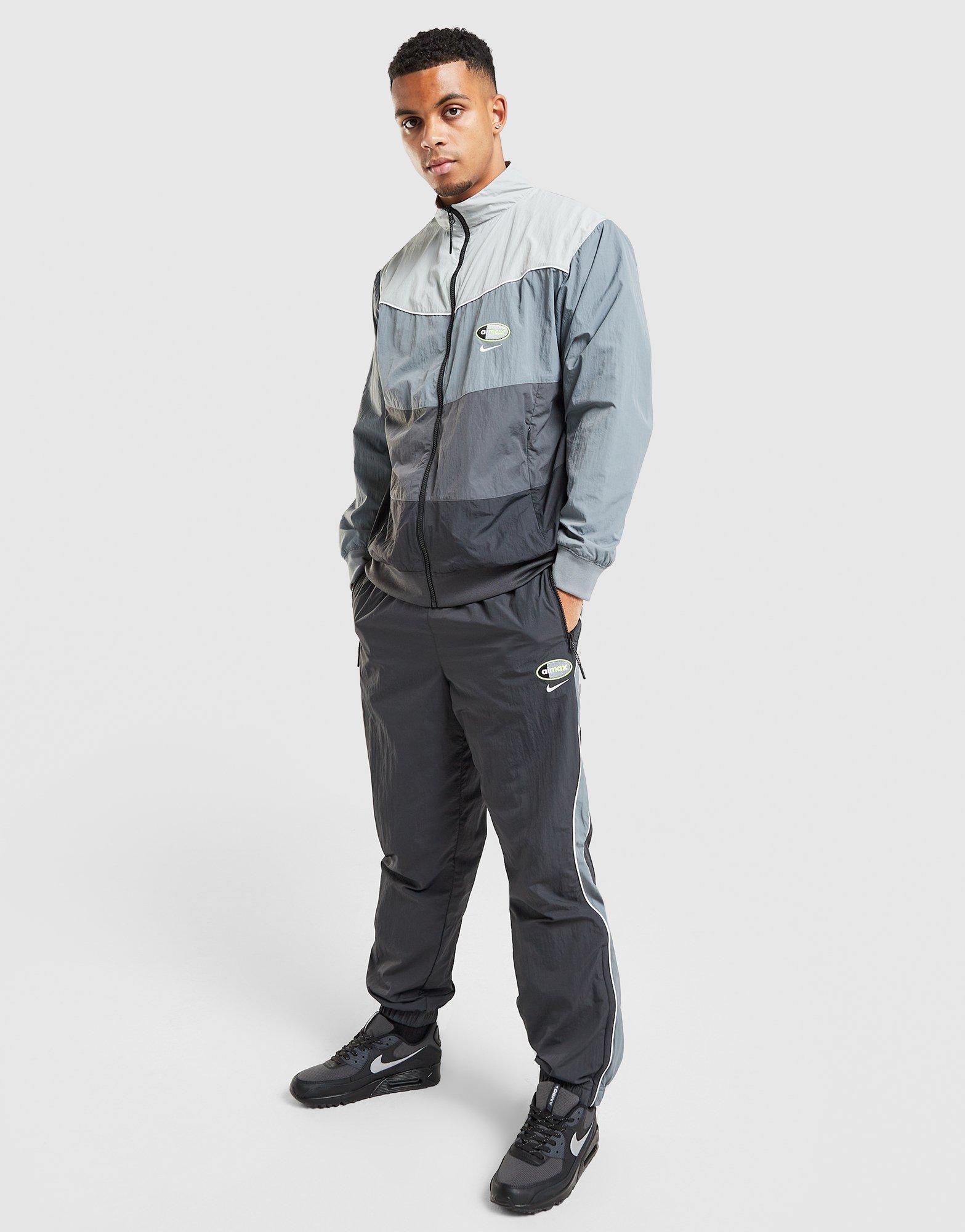 Pánské kalhoty NIKE KALHOTY  M NSW AIR MAX 95 WVN PANT IO3153-060 Šedá