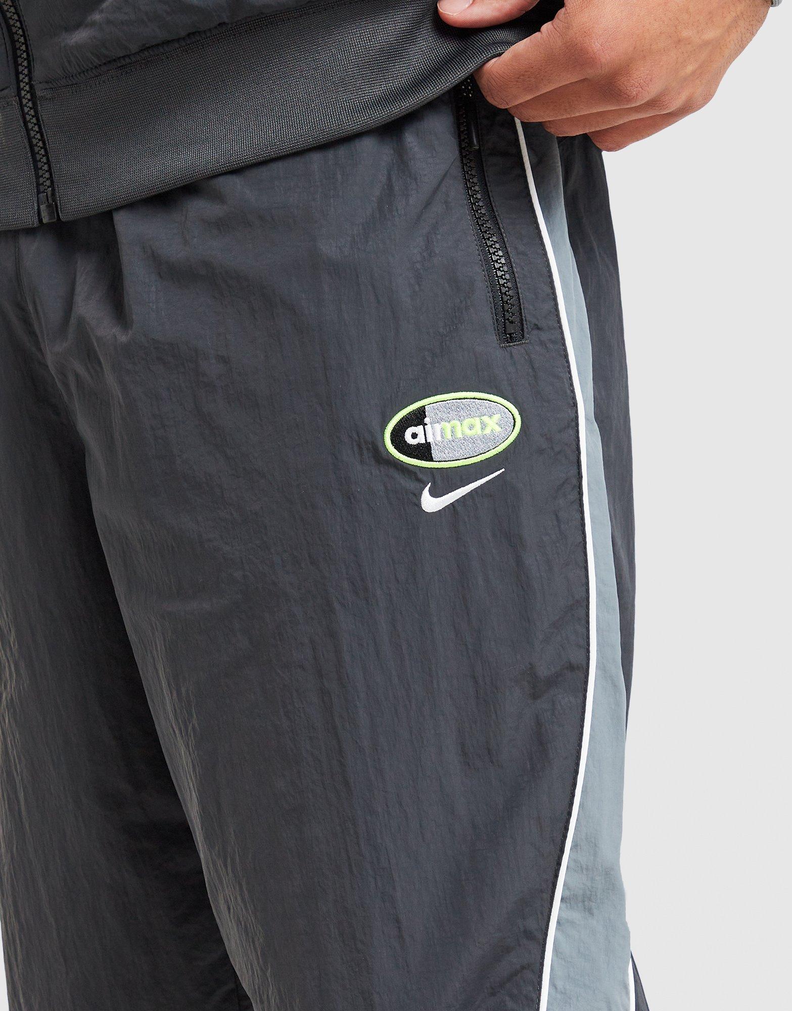 Pánské kalhoty NIKE KALHOTY  M NSW AIR MAX 95 WVN PANT IO3153-060 Šedá