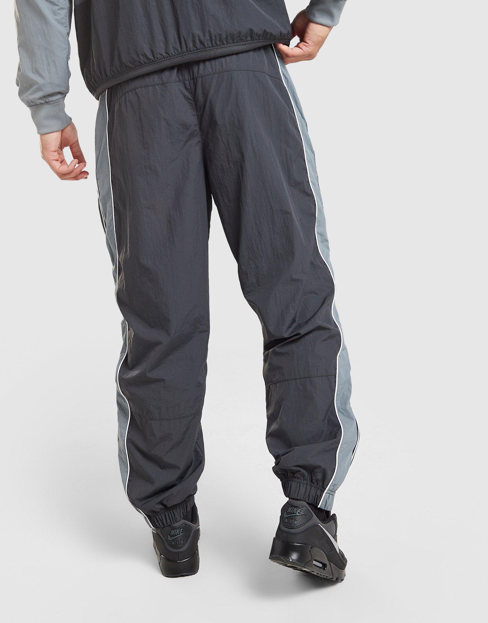 Pánské kalhoty NIKE KALHOTY  M NSW AIR MAX 95 WVN PANT IO3153-060 Šedá