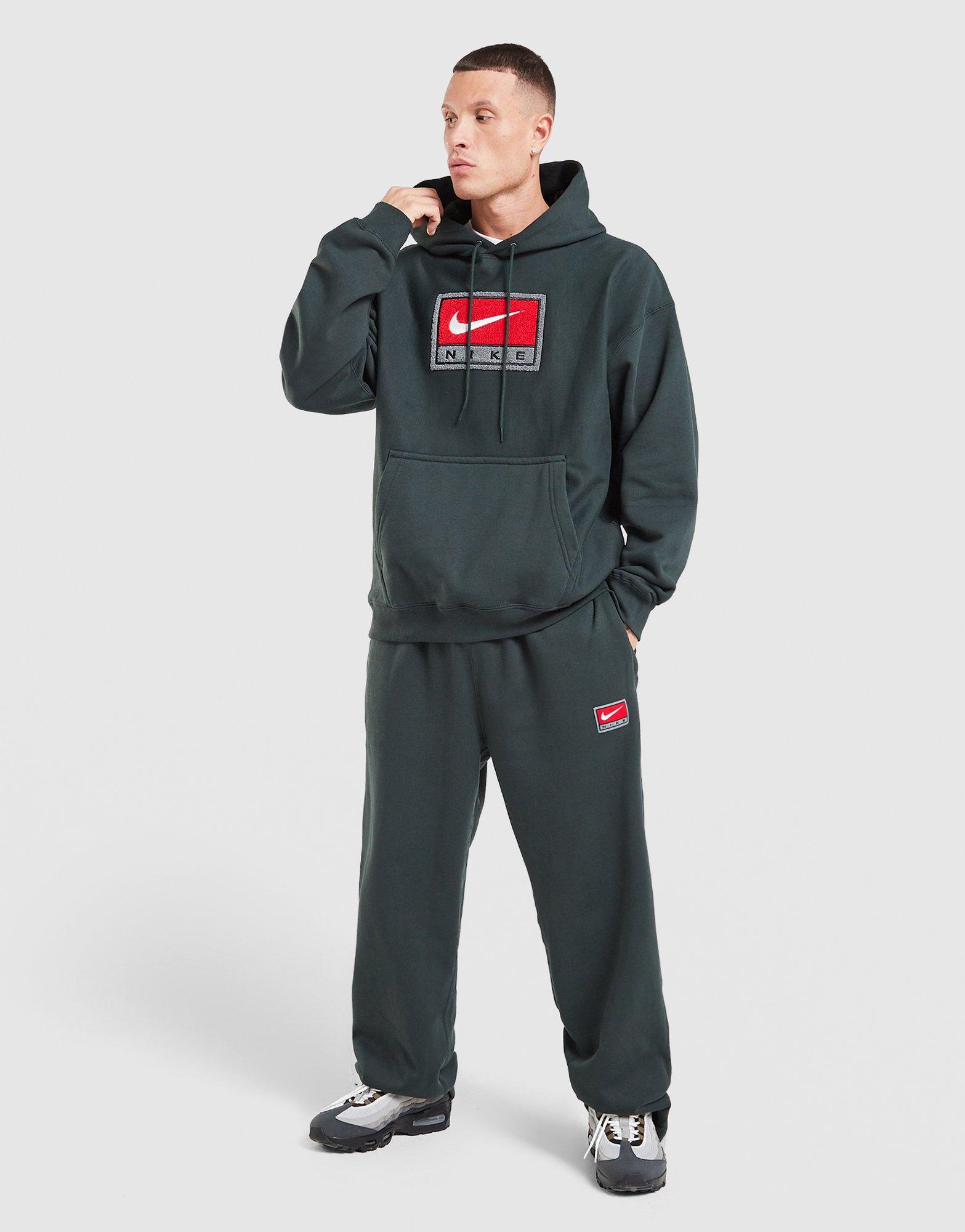 Pantaloni pentru bărbați NIKE PANTALONI  M NL SOLO SWSH BB OH PANT GFX IO0675-317 Negru