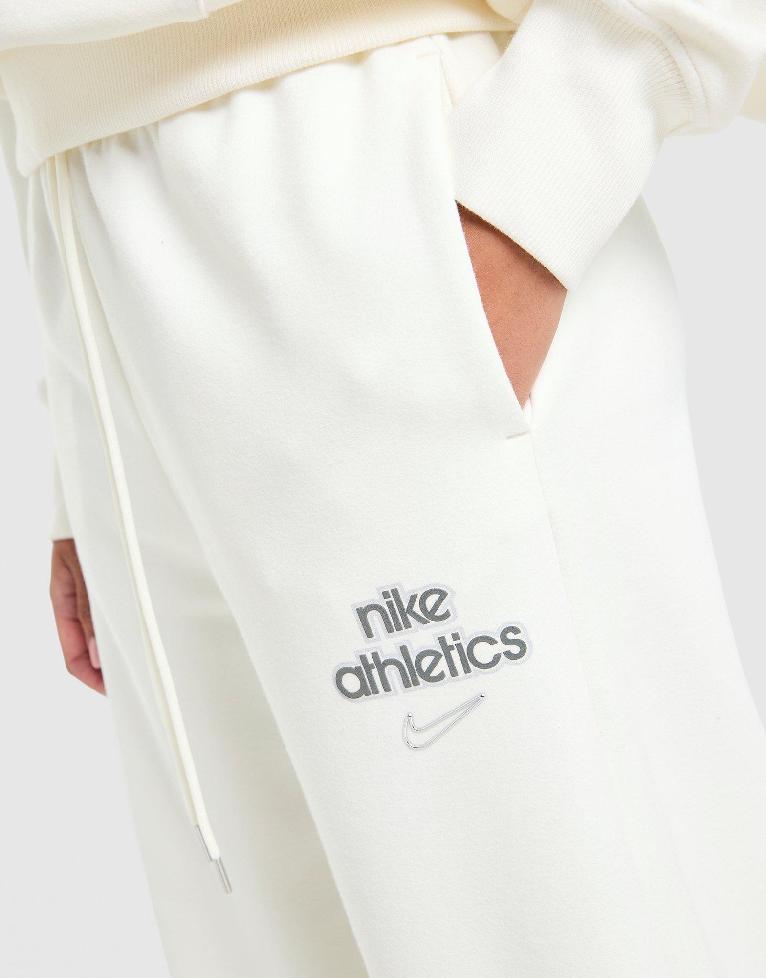 Dámske nohavice NIKE NOHAVICE  W NK PHNX FLC HR PANT WD GLS IO1297-133 Béžová