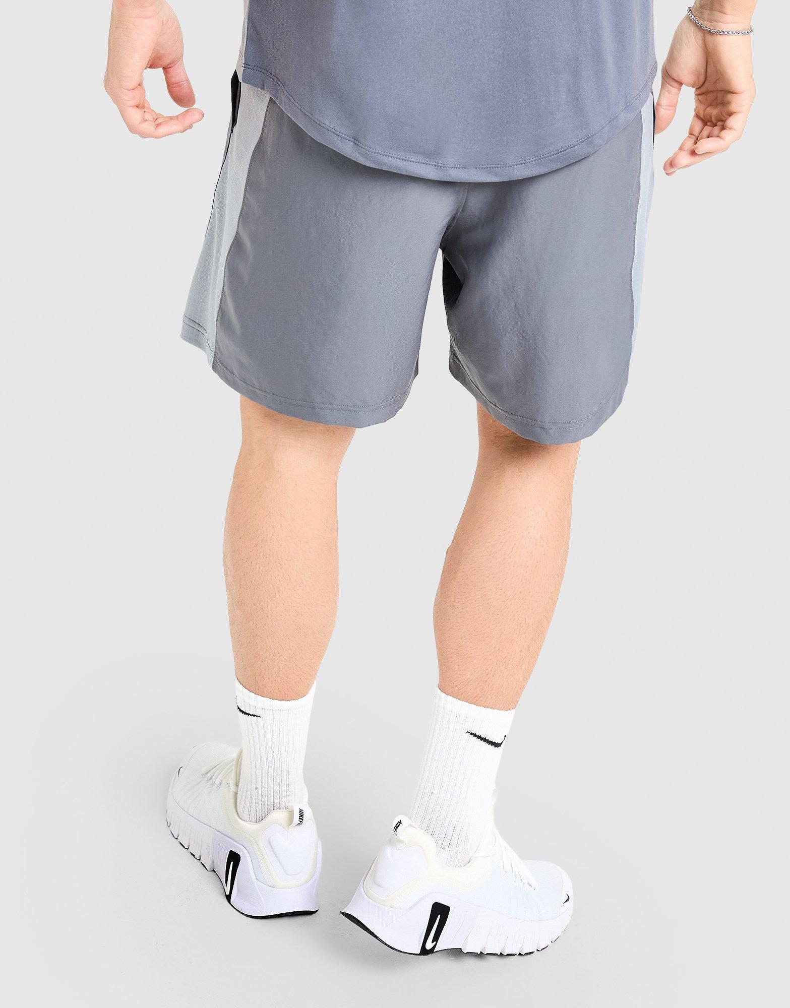 Krótkie spodenki, szorty męskie UNDER ARMOUR SZORTY WOVEN BLOCKED SHORTS 6013157-025 Szary