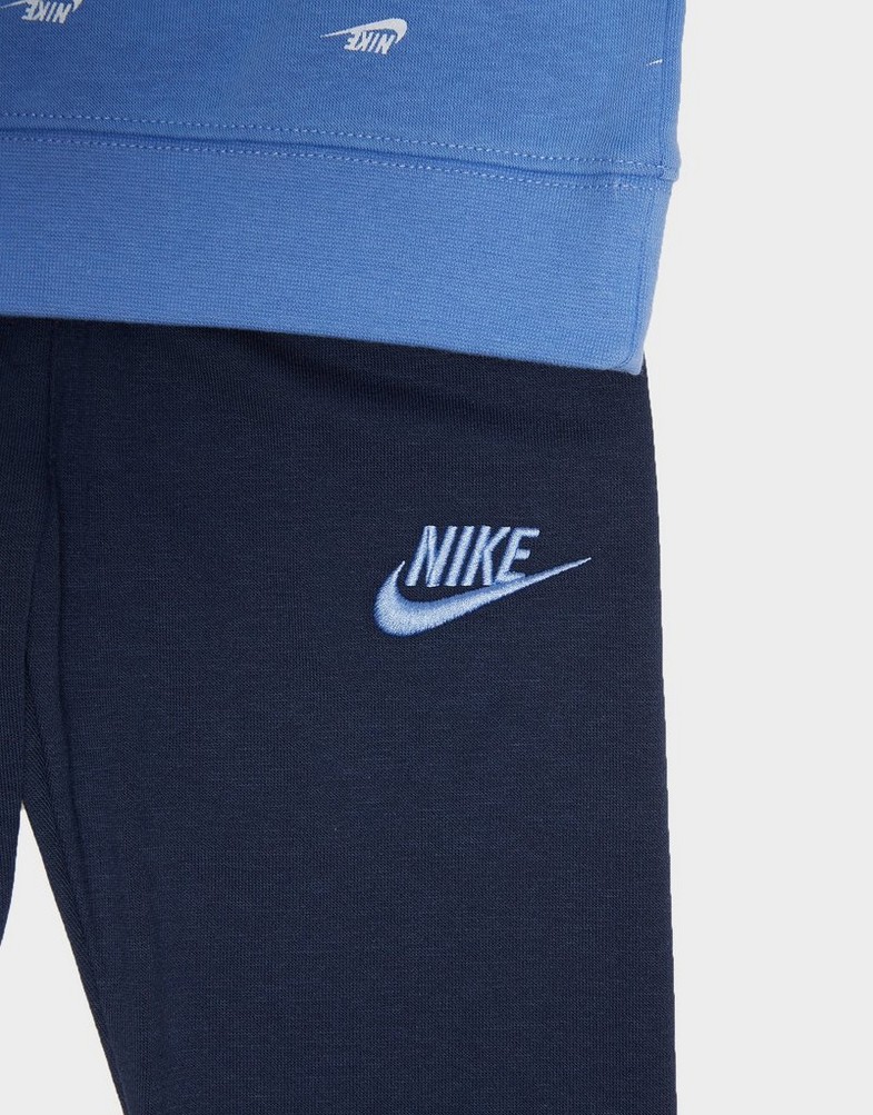 Дитячі спортивні костюми NIKE СПОРТИВНИЙ КОСТЮМ B NSW CLUB SSNL AOP SET 86J802-BGZ Блакитний