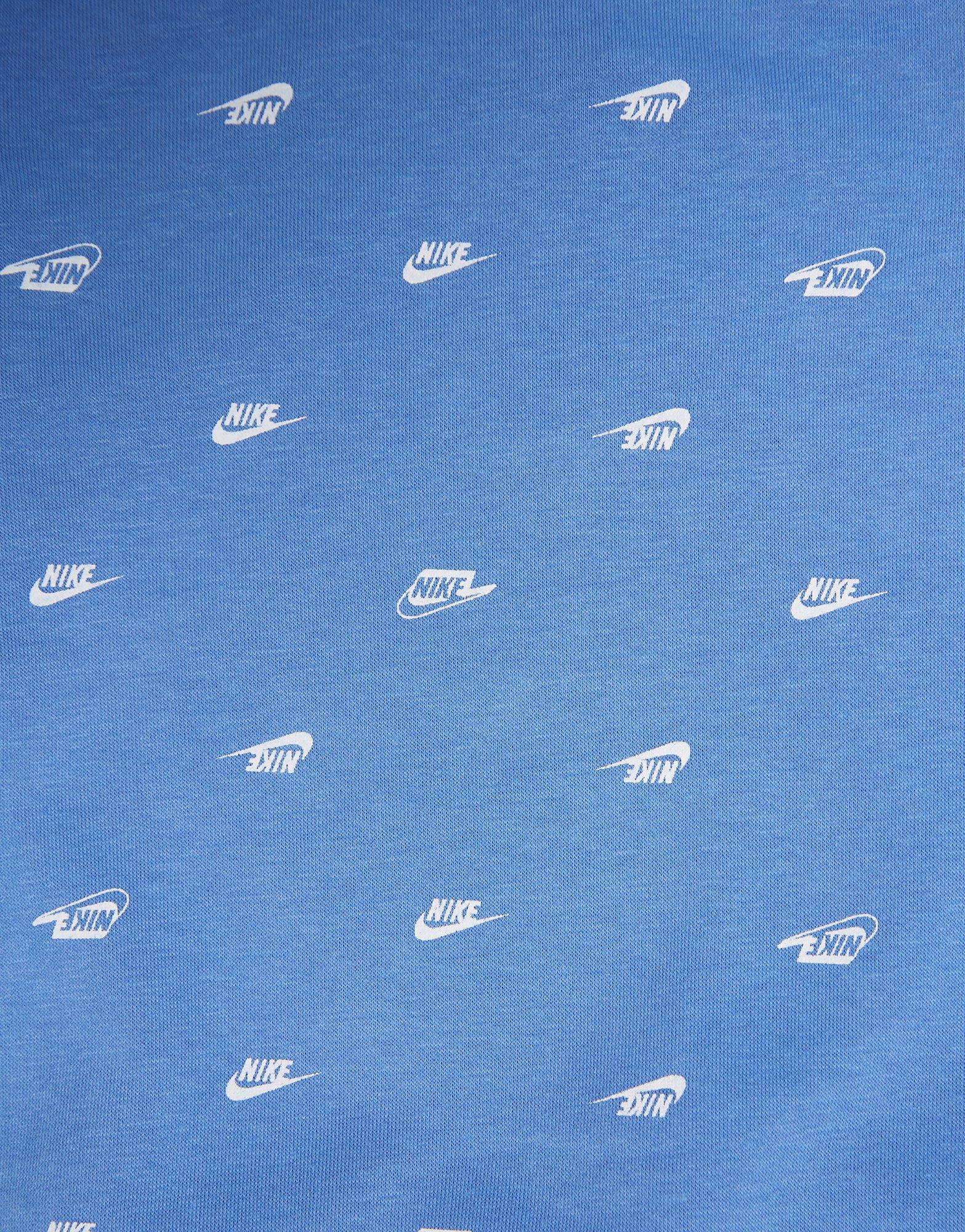 Дитячі спортивні костюми NIKE СПОРТИВНИЙ КОСТЮМ B NSW CLUB SSNL AOP SET 86J802-BGZ Блакитний