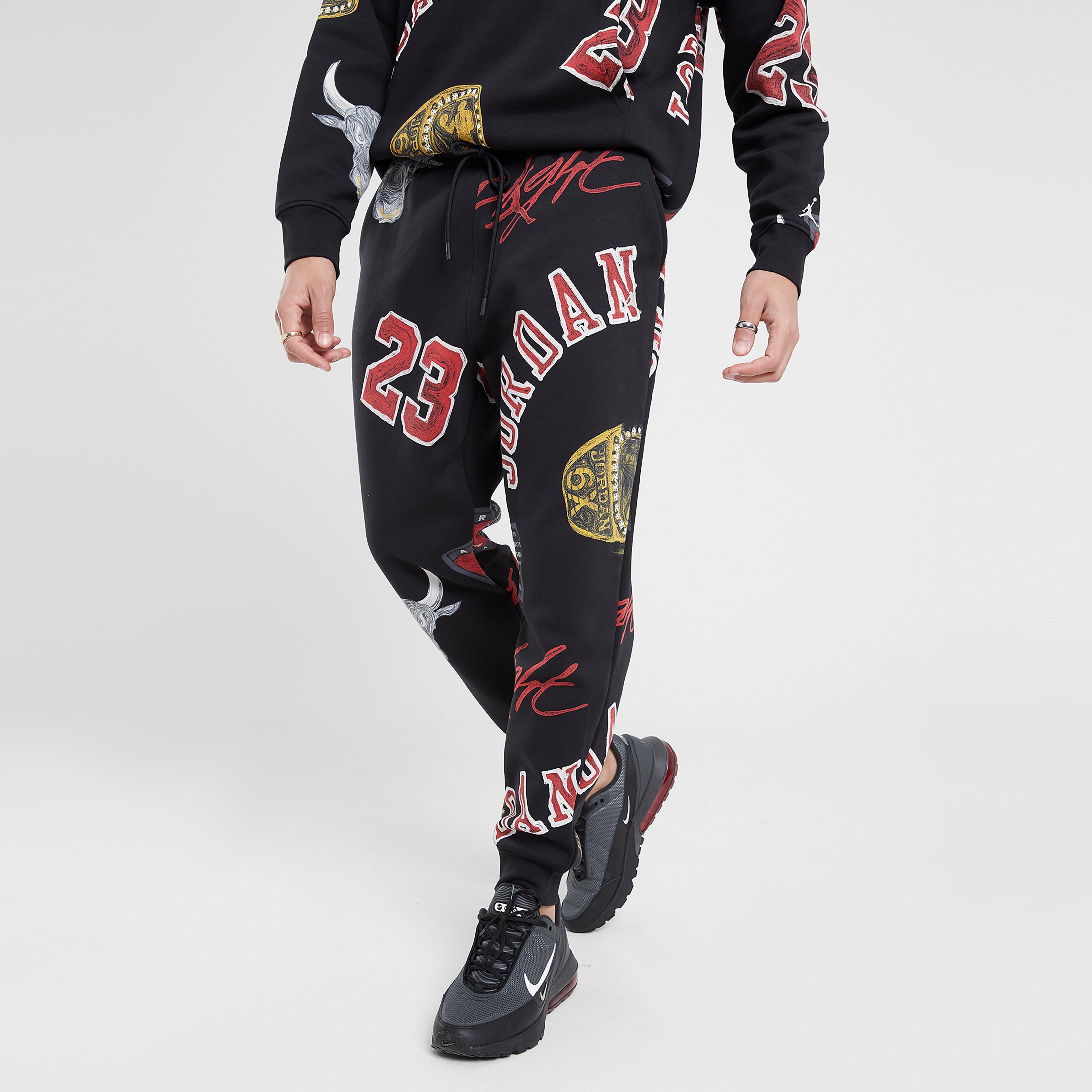 Férfi melegítőnadrág és jogger JORDAN NADRÁG M J ESS AOP FLC PANT