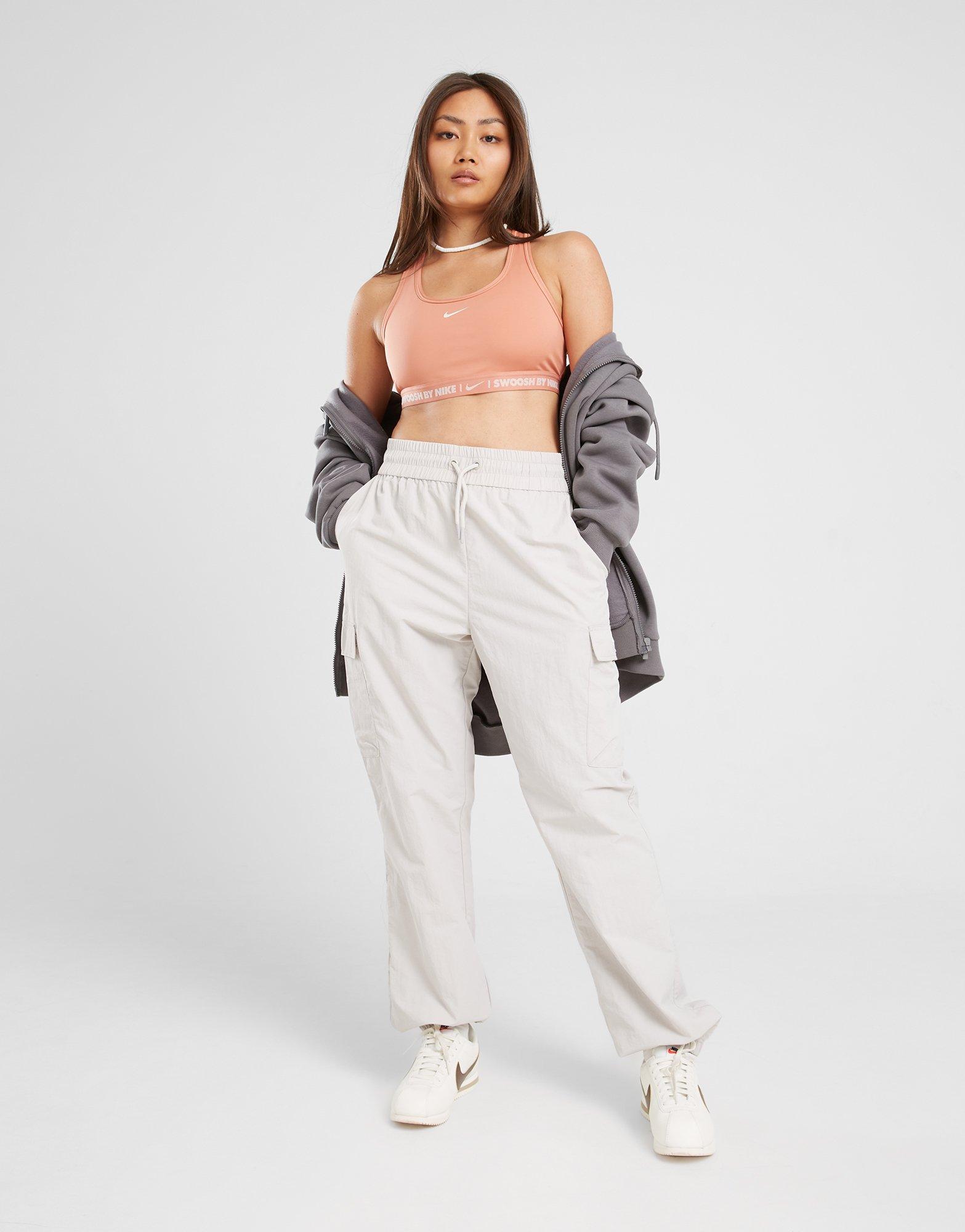 Дамско фитнес облекло NIKE BRA W NK SWSH MED SPT BRA GLS HF6425-212 Коралов