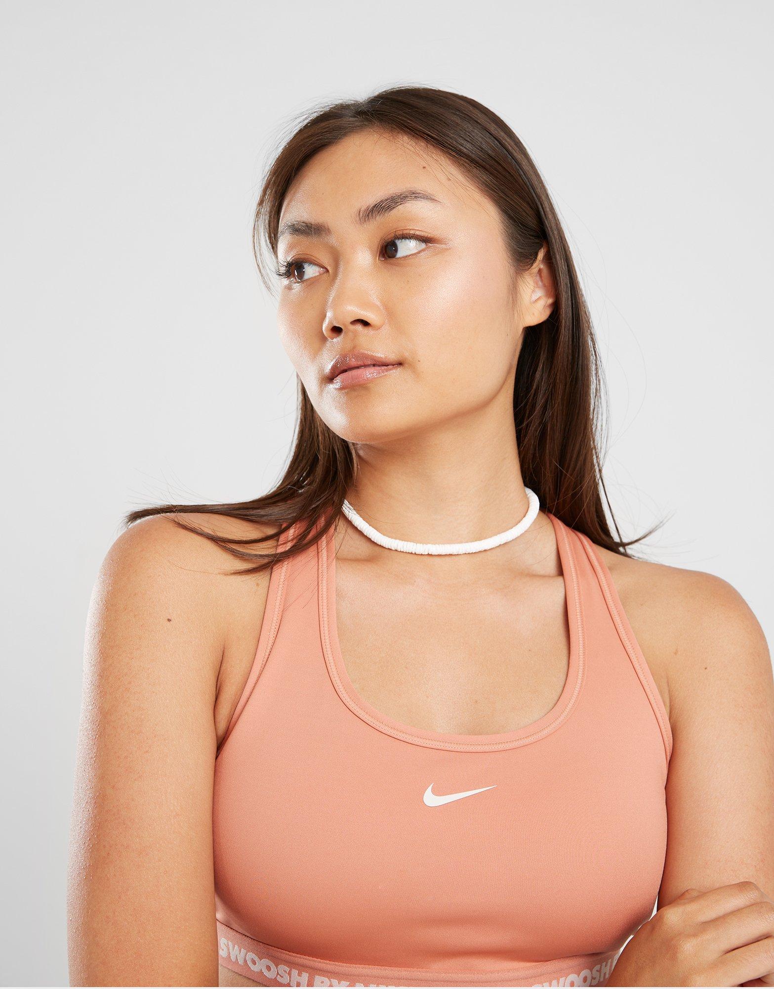 Дамско фитнес облекло NIKE BRA W NK SWSH MED SPT BRA GLS HF6425-212 Коралов