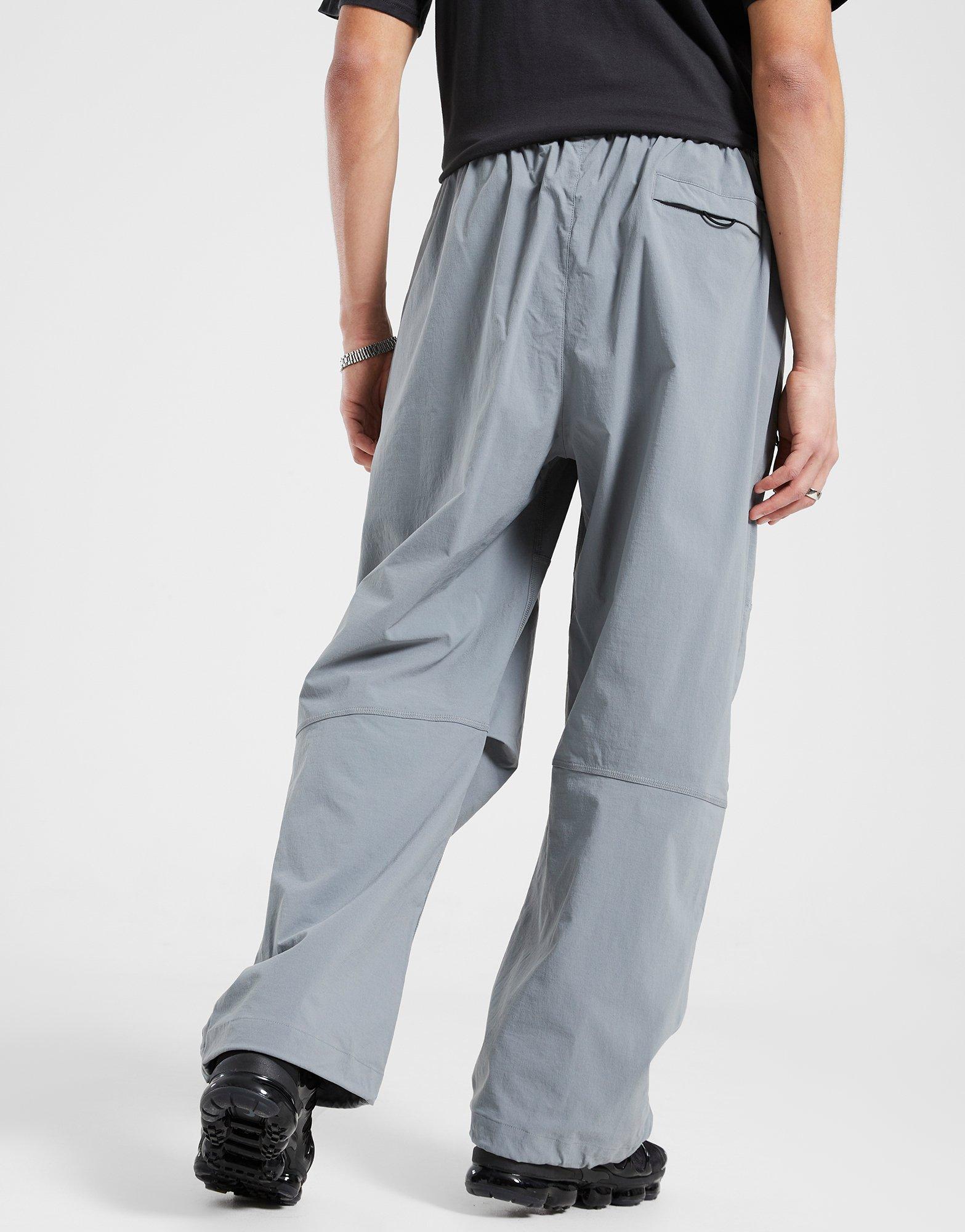 Pánske nohavice NIKE NOHAVICE  M NK TCH WVN PNT OS HV6515-065 Sivá