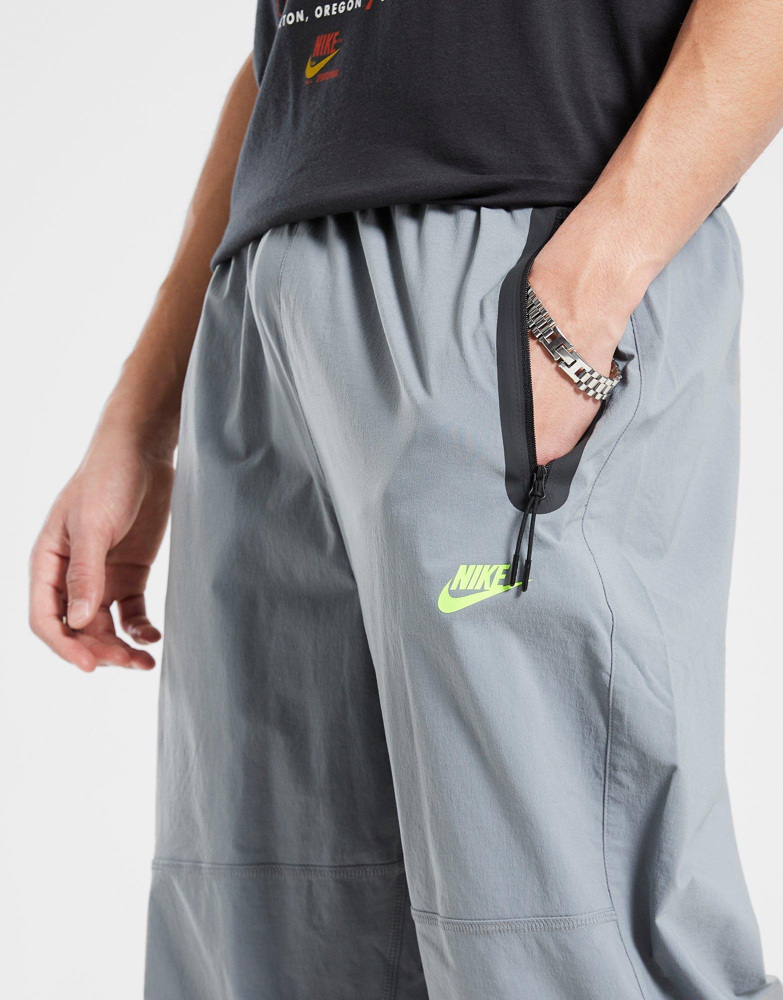 Pánske nohavice NIKE NOHAVICE  M NK TCH WVN PNT OS HV6515-065 Sivá