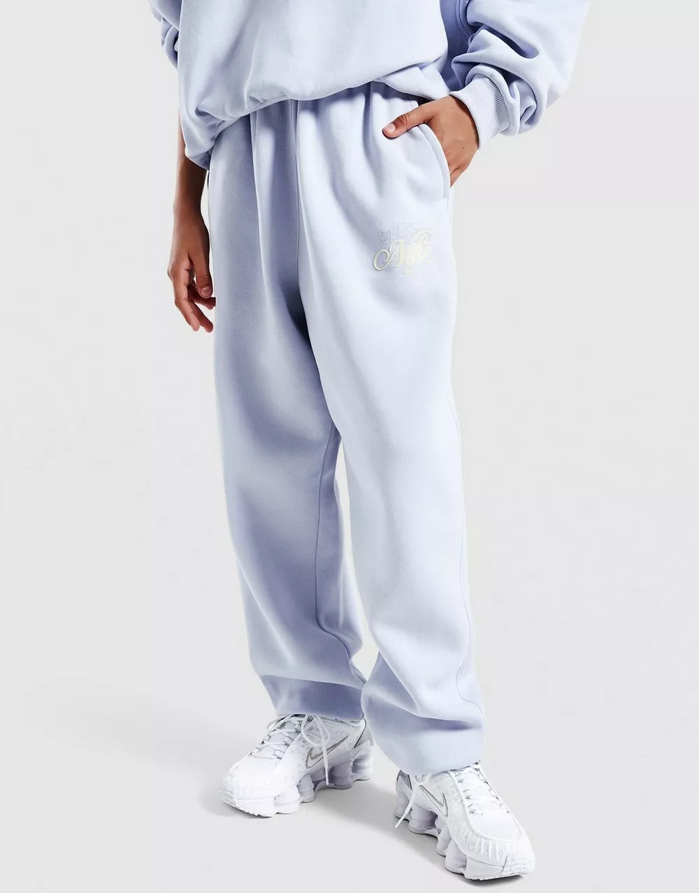 NIKE ШТАНИ G NSW CLUB FLC LSE PNT GFX, фото 1 з 4