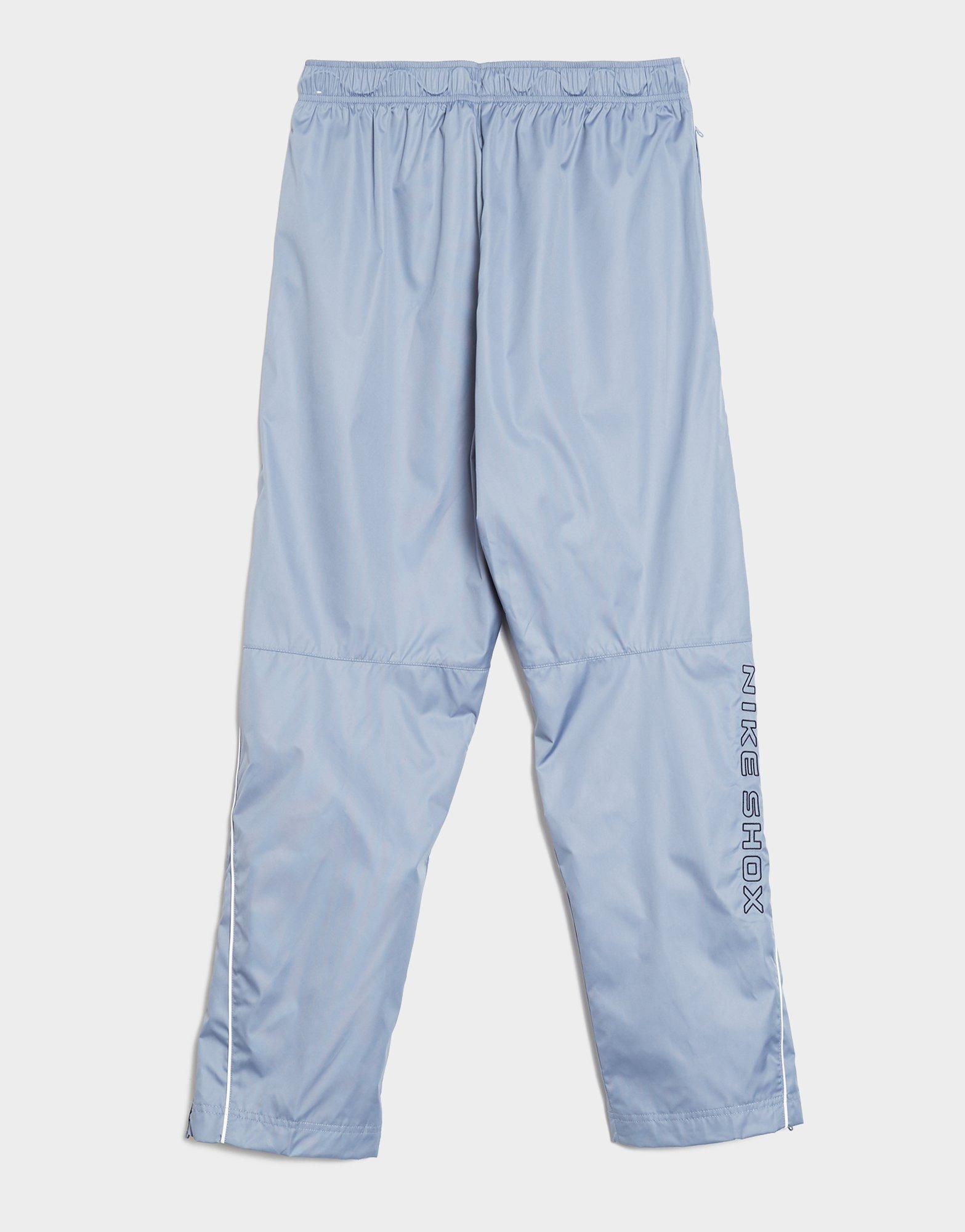 NIKE SPODNIE M NSW WVN PANT SHOX IH0653-493 Niebieski