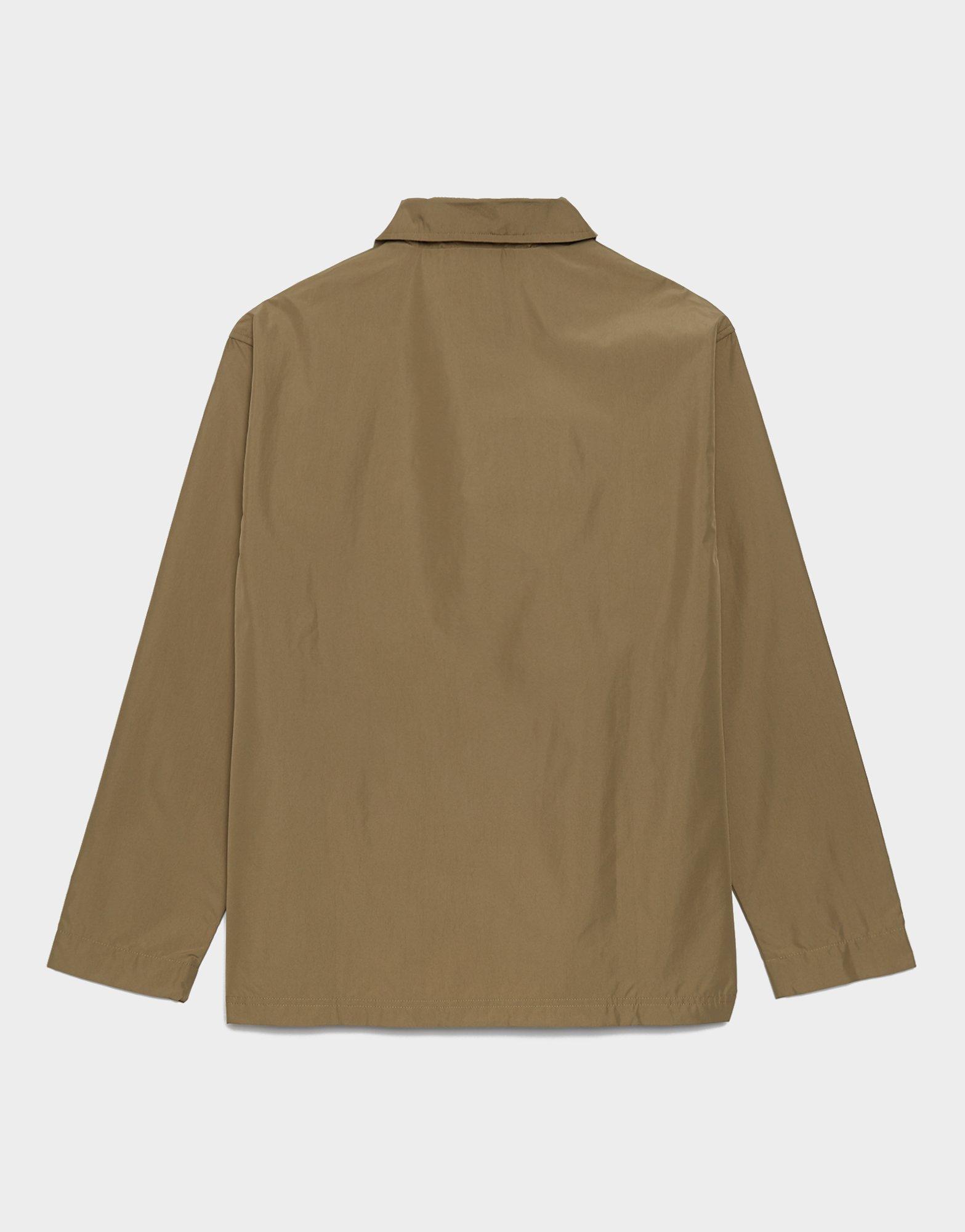 NEW BALANCE JAKNA JAKNA ESSENTIALS REIMAGINED WOVEN CGN MJ31531CGN bež