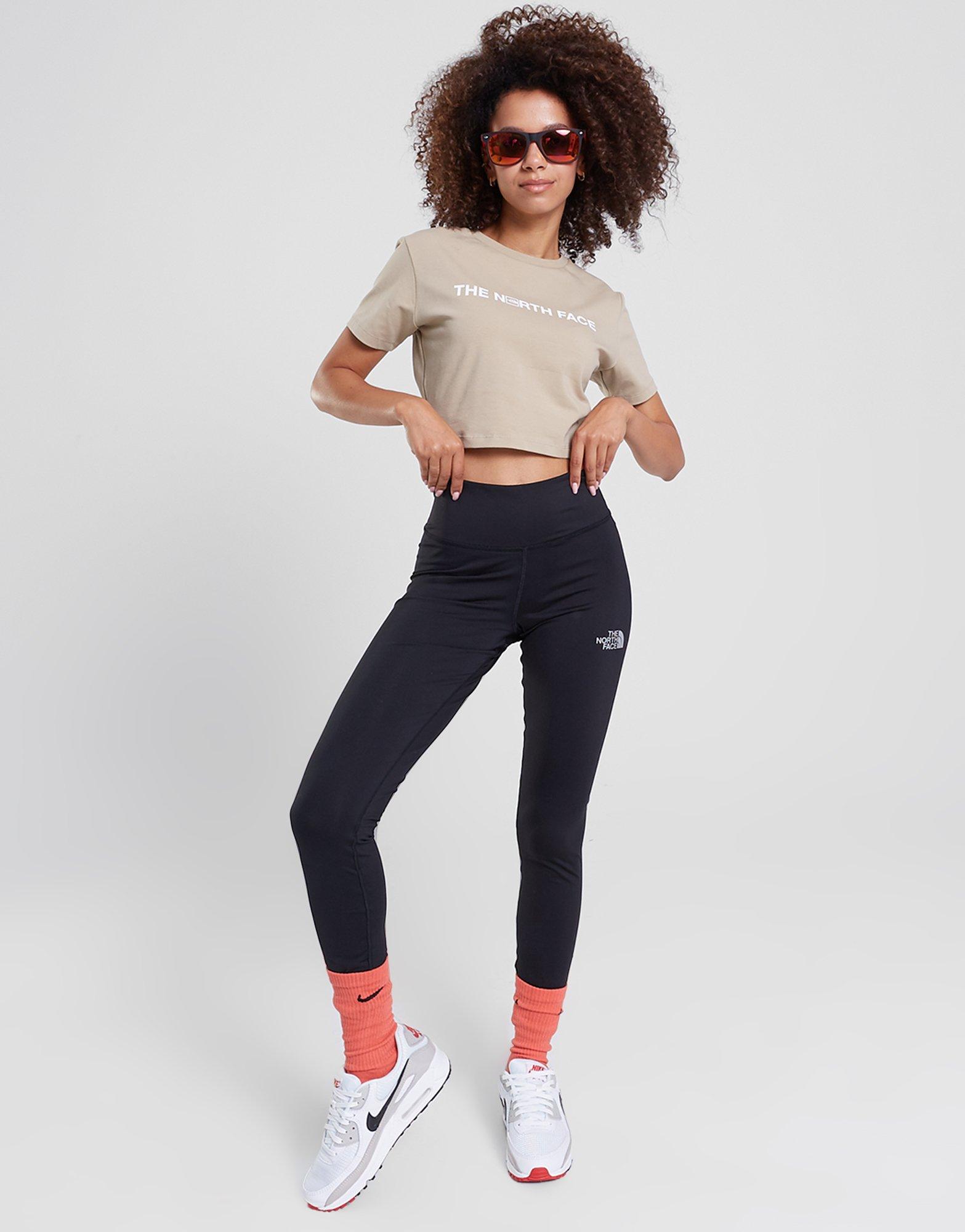 Moteriški marškinėliai THE NORTH FACE MARŠKINĖLIAI   OUTLINE GRAPHIC SS CR FLAX NF0A859CCEL1 Rusva