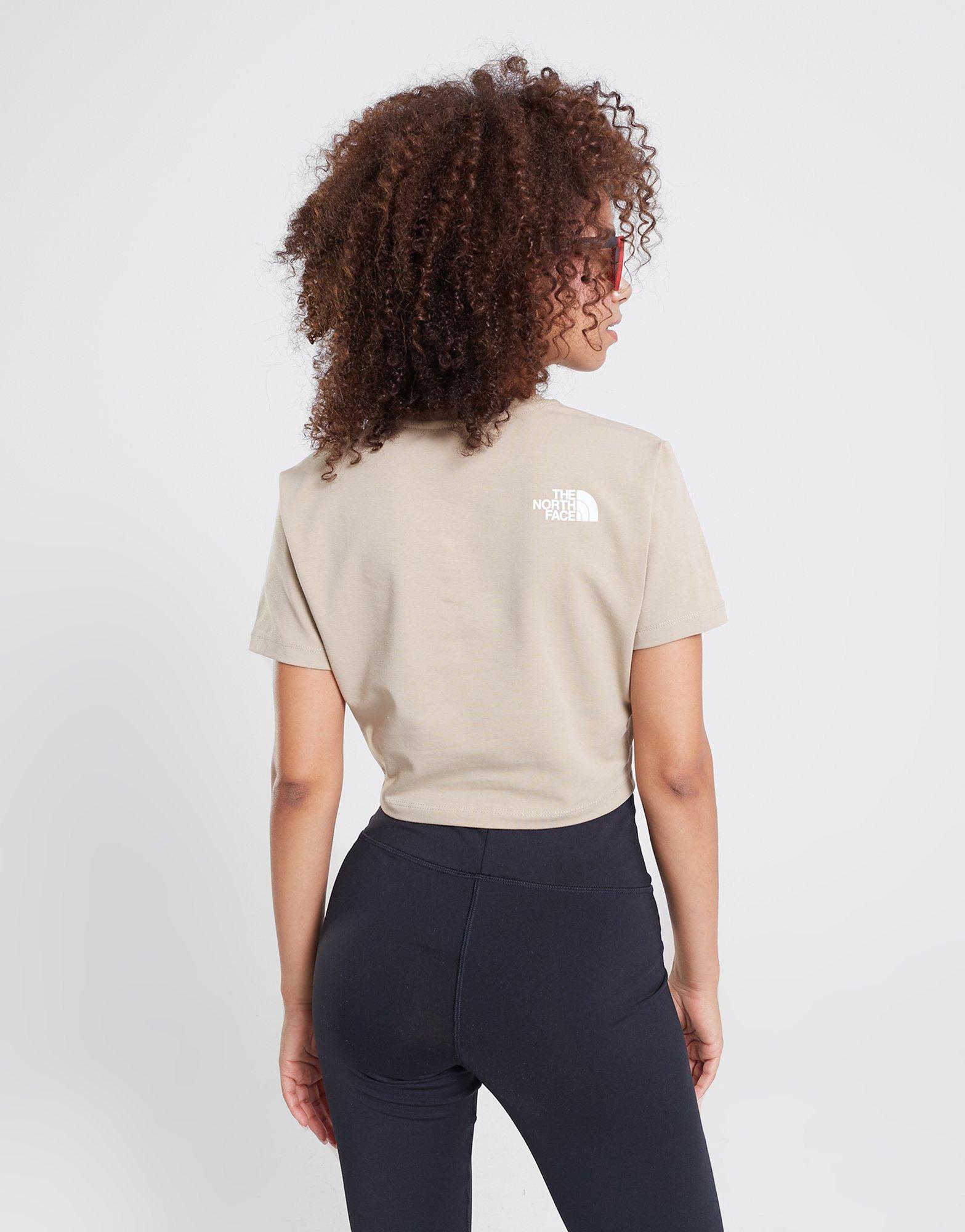 Moteriški marškinėliai THE NORTH FACE MARŠKINĖLIAI   OUTLINE GRAPHIC SS CR FLAX NF0A859CCEL1 Rusva