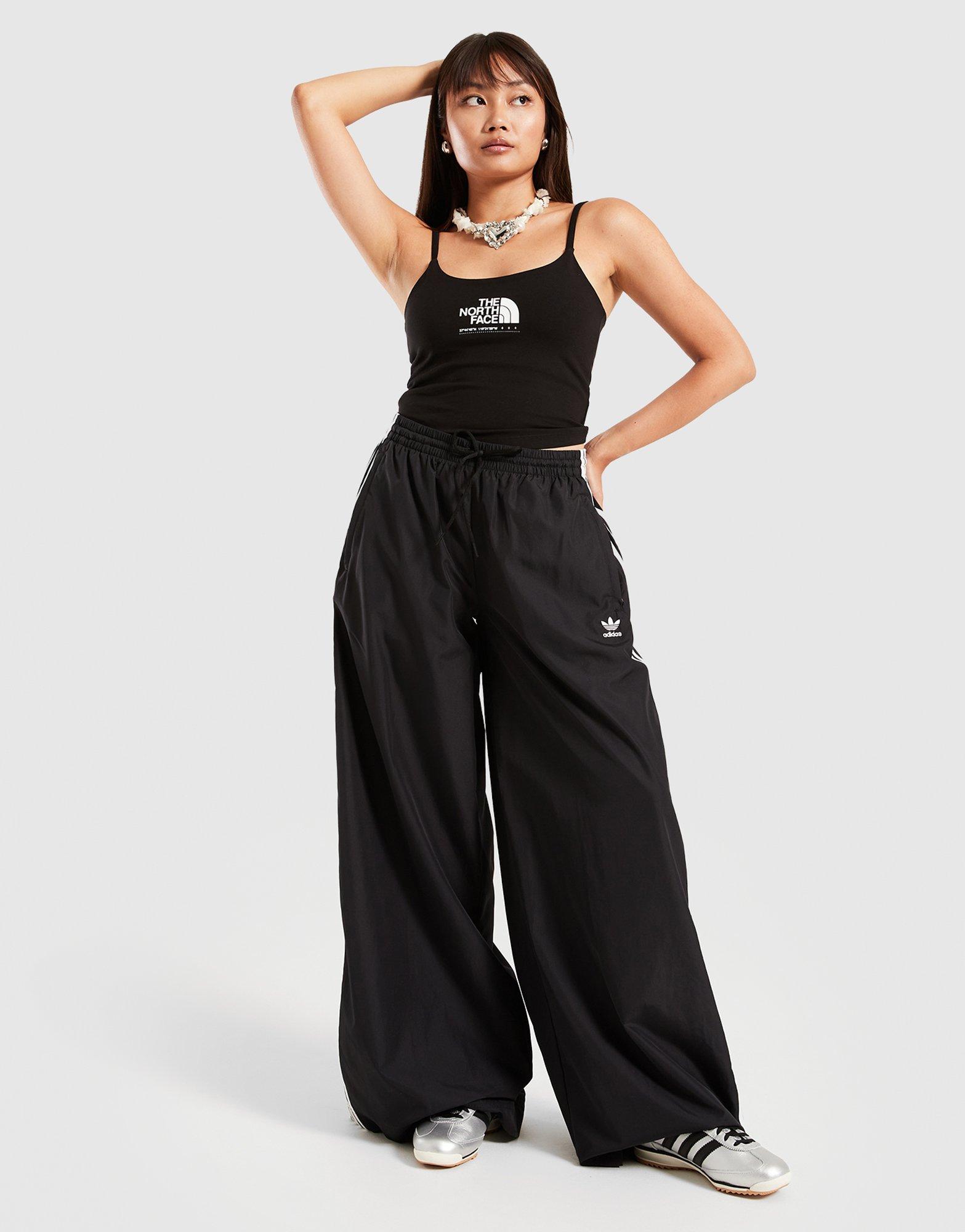 Жіночі топи THE NORTH FACE ТОП TECH SHINE SLIM МАЙКА BLK NF0A8CBXJK31 Чорний