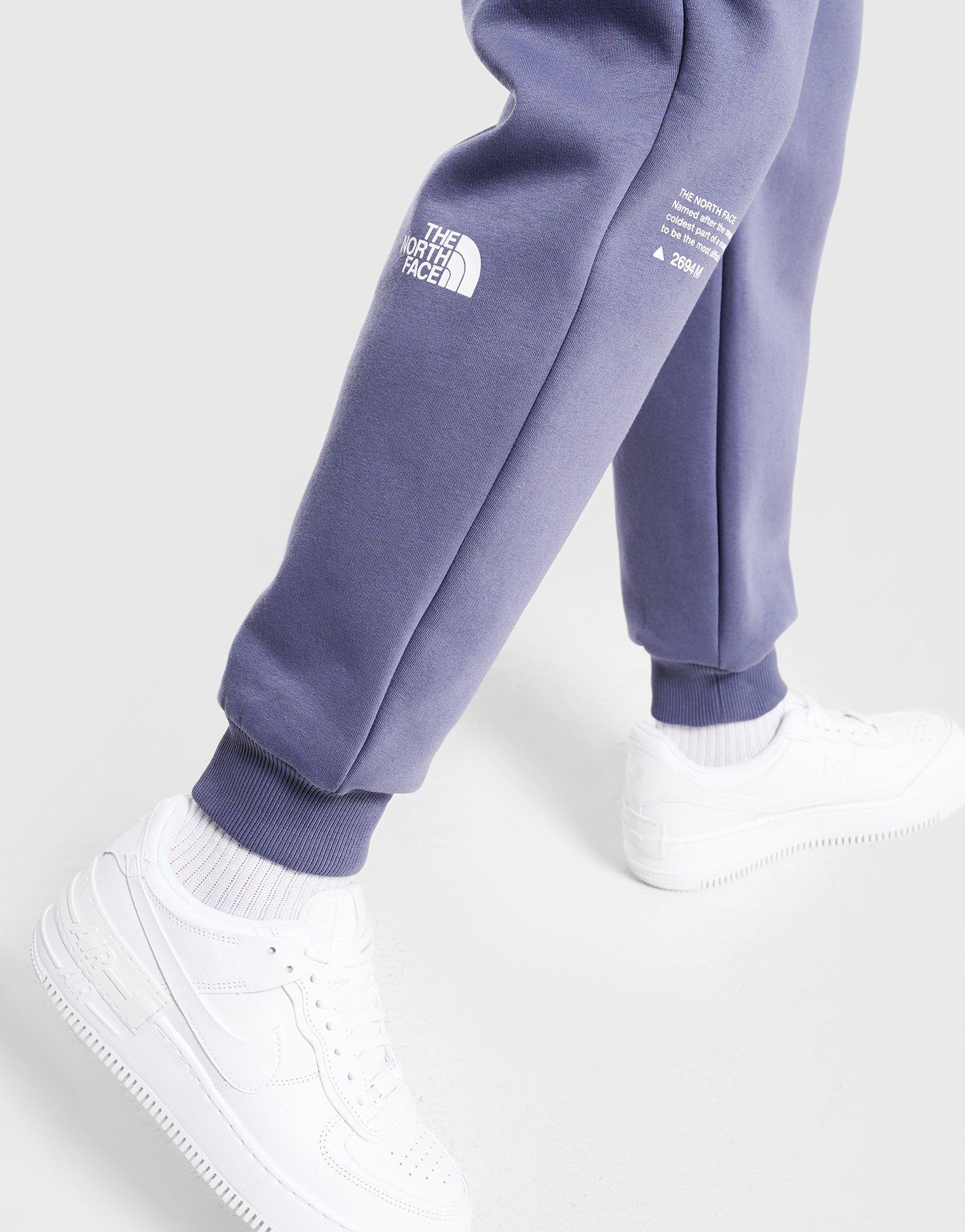 Pantaloni pentru femei THE NORTH FACE PANTALONI  W LOCATION GRAPHIC PANT NF0A8F7NBTR1 Bleumarin