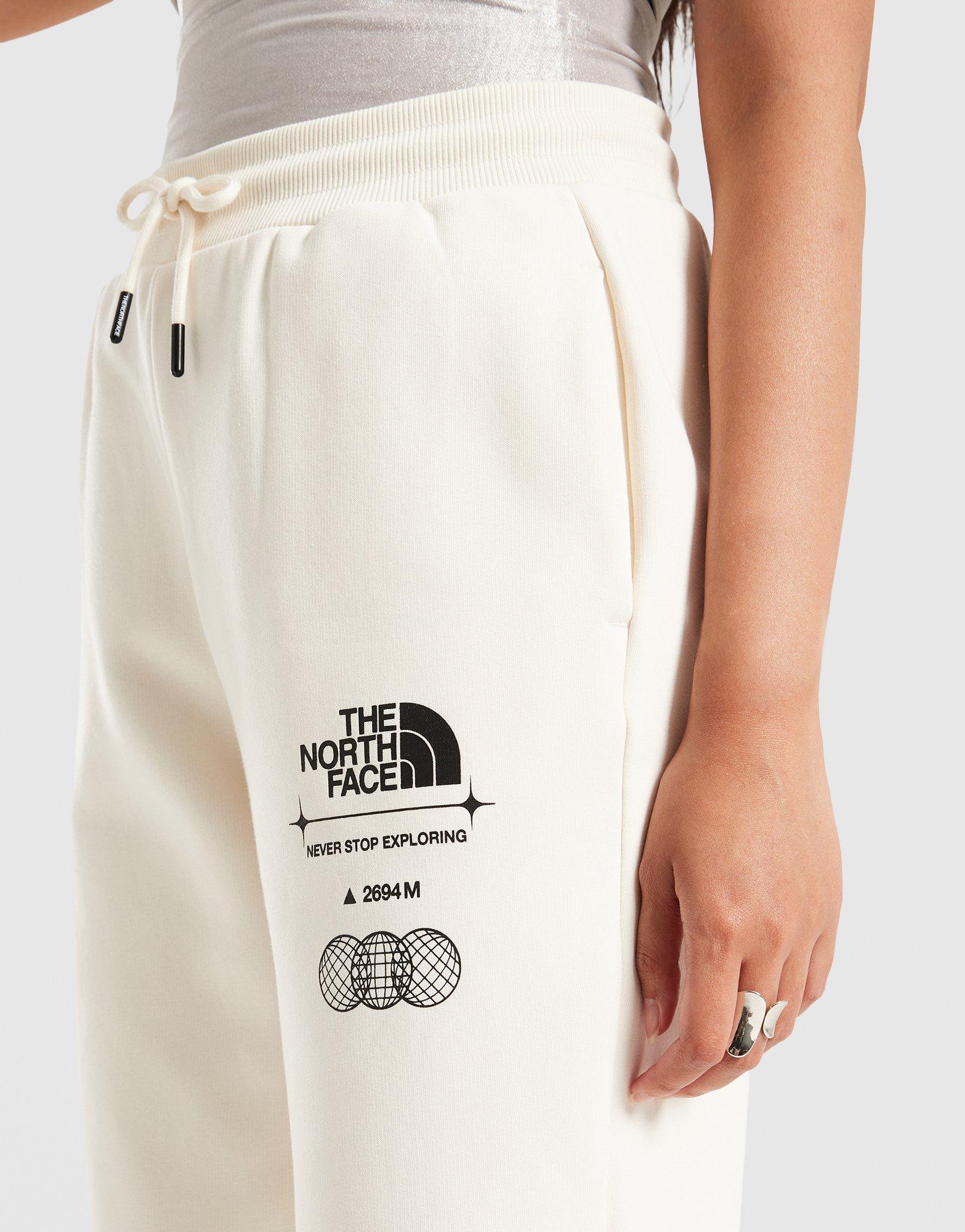Жіночі штани THE NORTH FACE ШТАНИ LOCATION GRAPHIC PANT NF0A8F7NQLI1 Бежевий