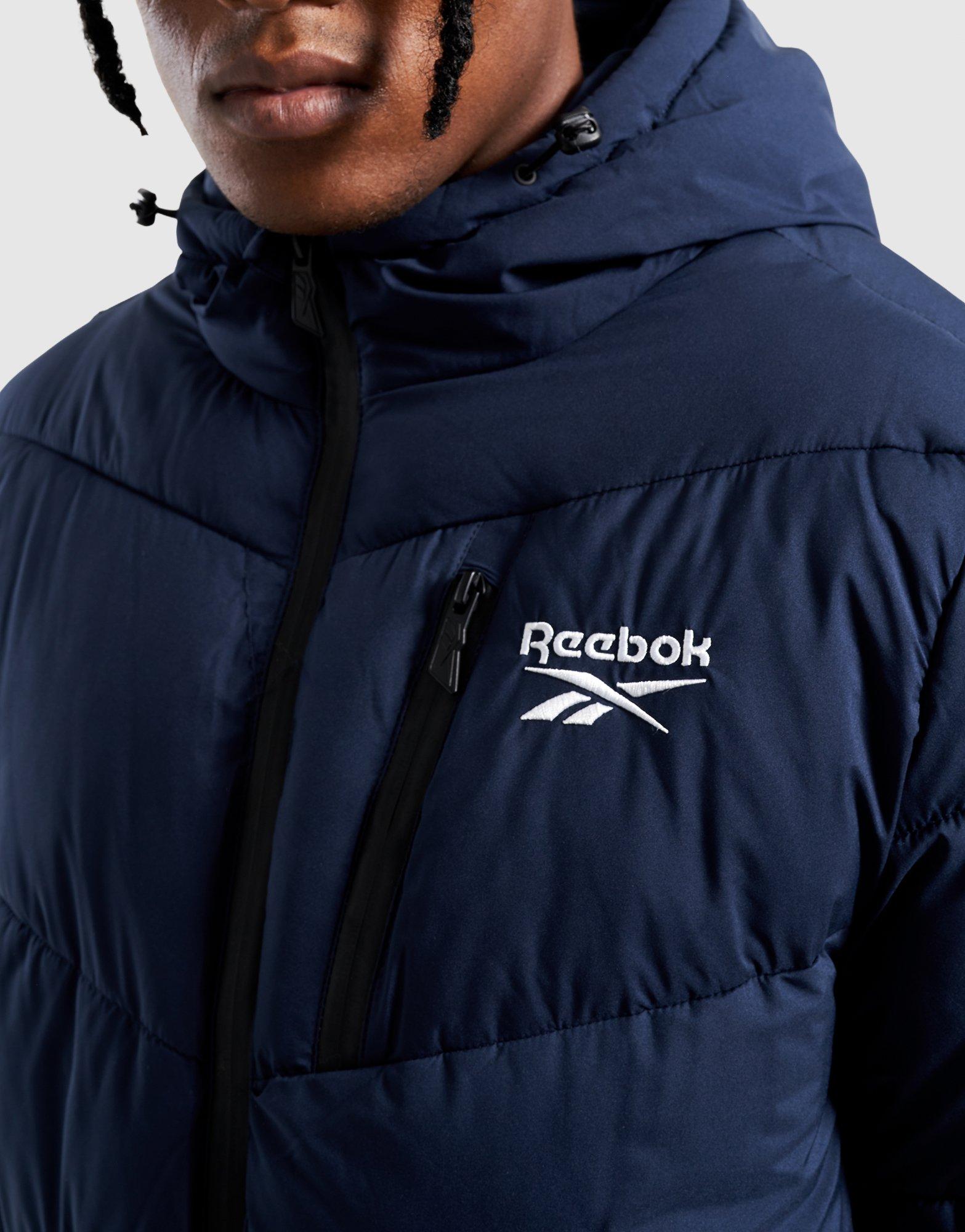 REEBOK BUNDA ZIMNÁ STRETCH PUFFER JACKET OMRB1567_VECTOR NAVY Modrá