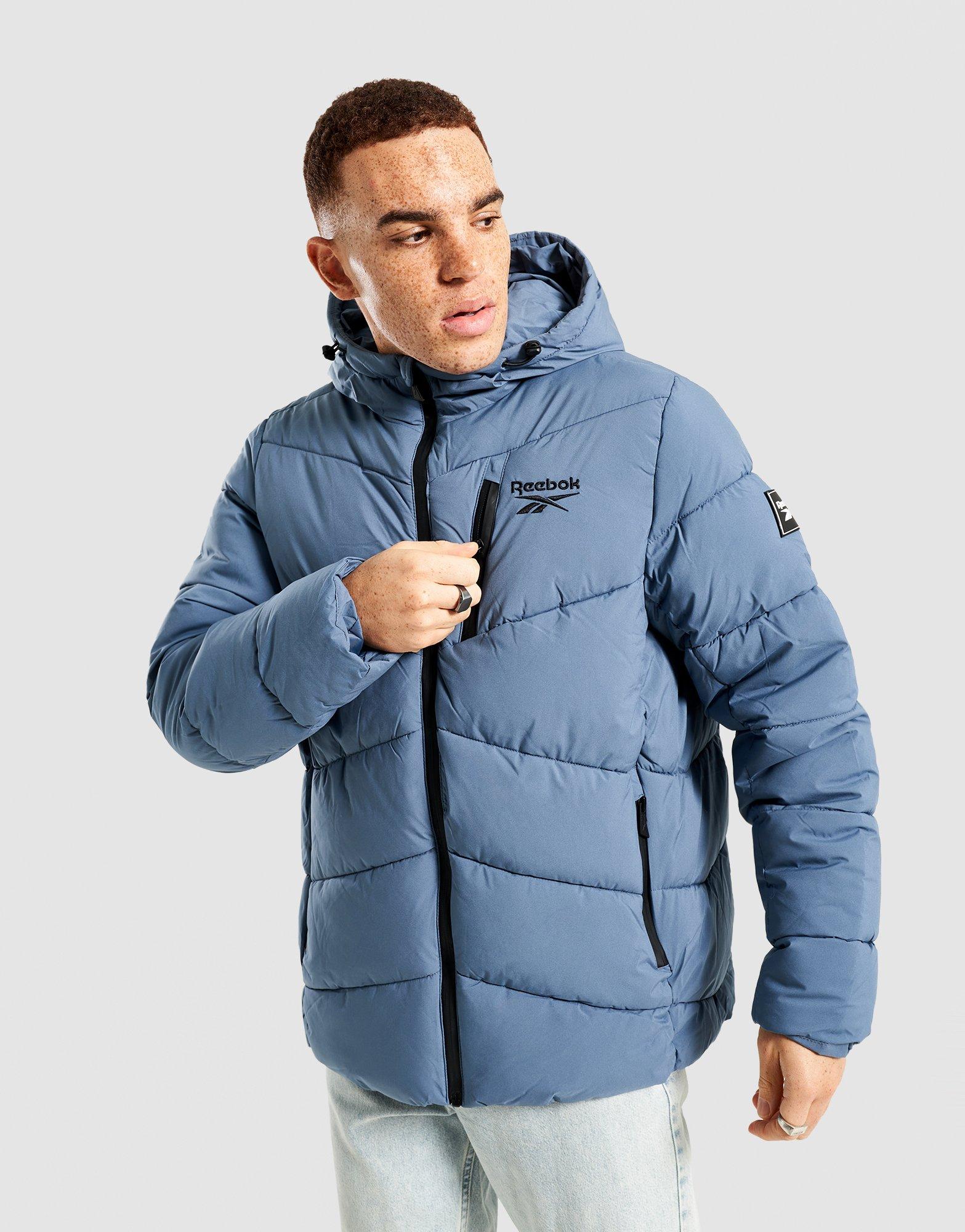 REEBOK КУРТКА ЗИМОВА STRETCH PUFFER JACKET OMRB1567_MINERAL BLU Темно-синій