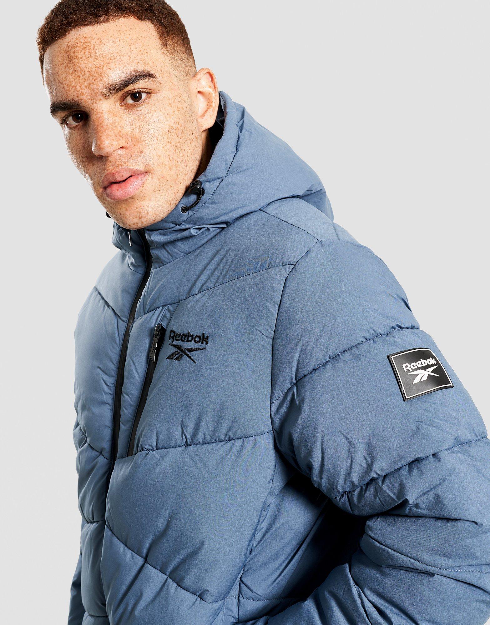 REEBOK КУРТКА ЗИМОВА STRETCH PUFFER JACKET OMRB1567_MINERAL BLU Темно-синій